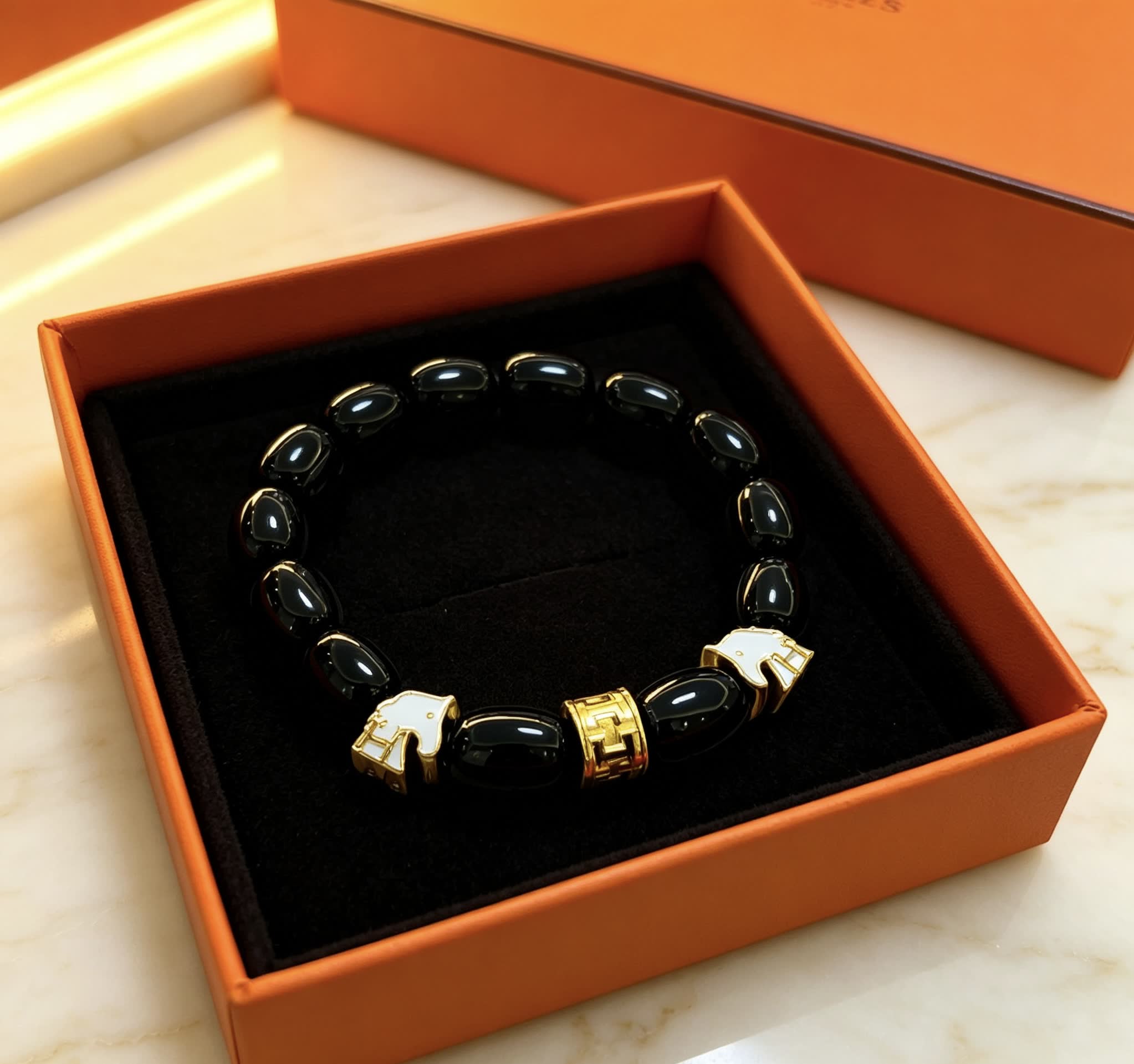 Hermes Hermès Black Beaded Bracelet with Gold Accents