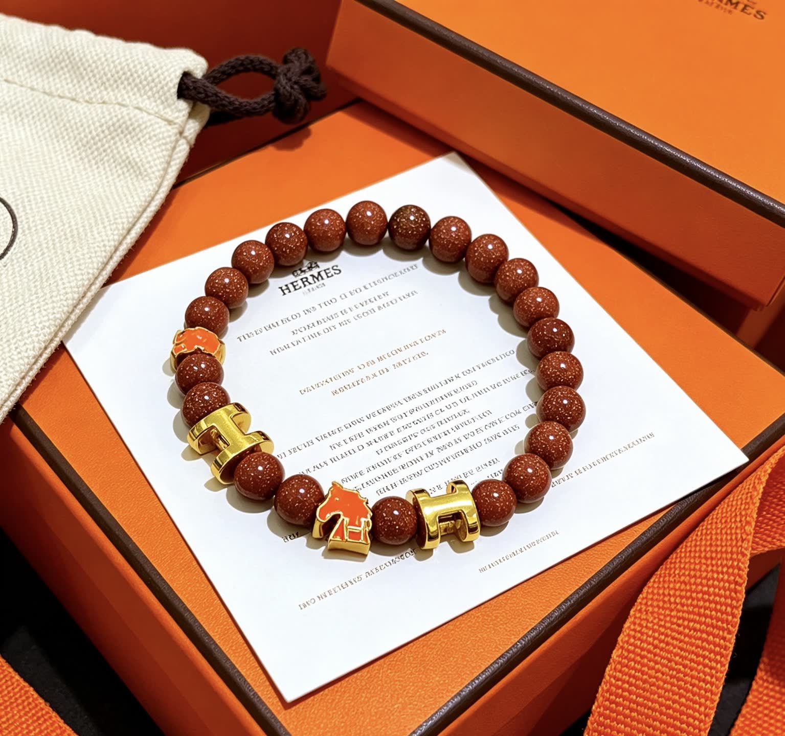 Hermes Hermès Brown Glitter Bead Bracelet with Gold Horseshoe Charms Hermes Hermès Brown Glitter Bead Bracelet with Gold Horseshoe Charms