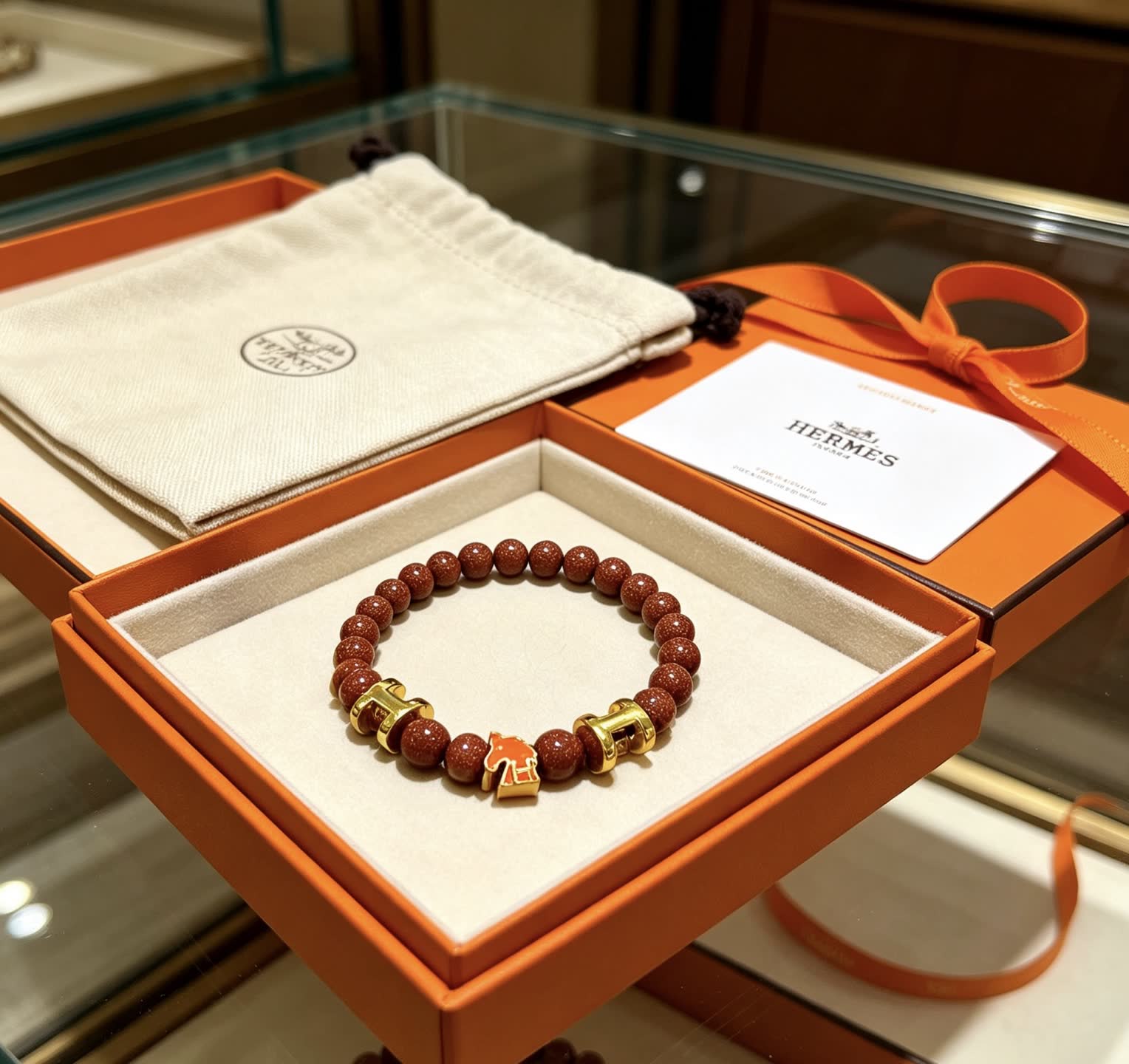 Hermes Hermès Brown Glitter Bead Bracelet with Gold Horseshoe Charms