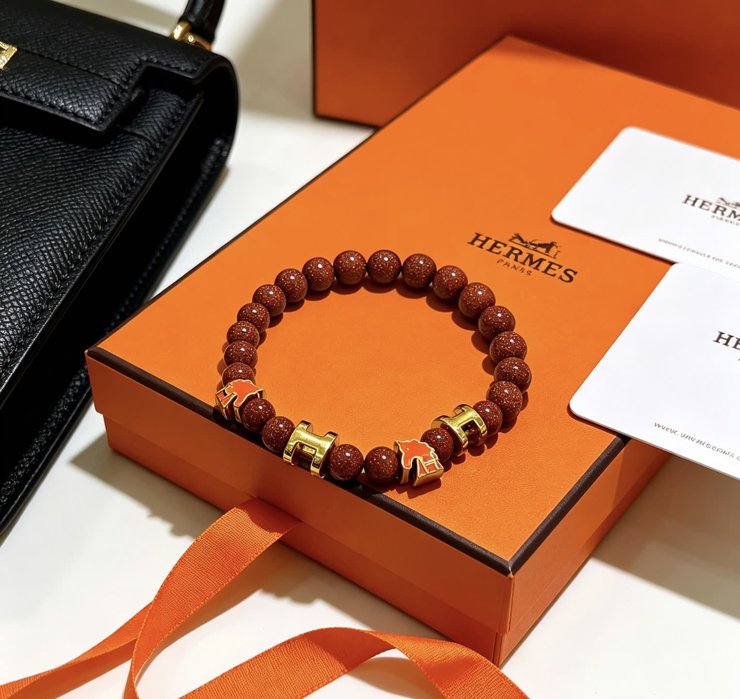 Hermes Hermès Brown Glitter Bead Bracelet with Gold Horseshoe Charms