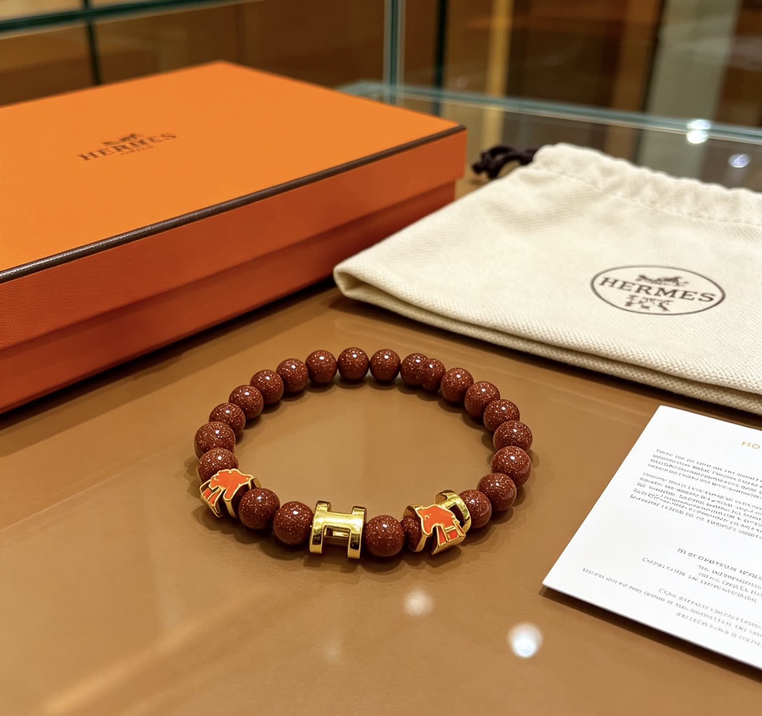 Hermes Hermès Brown Glitter Bead Bracelet with Gold Horseshoe Charms