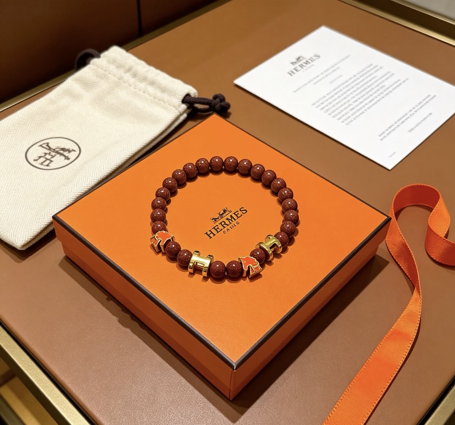 Hermes Hermès Brown Glitter Bead Bracelet with Gold Horseshoe Charms