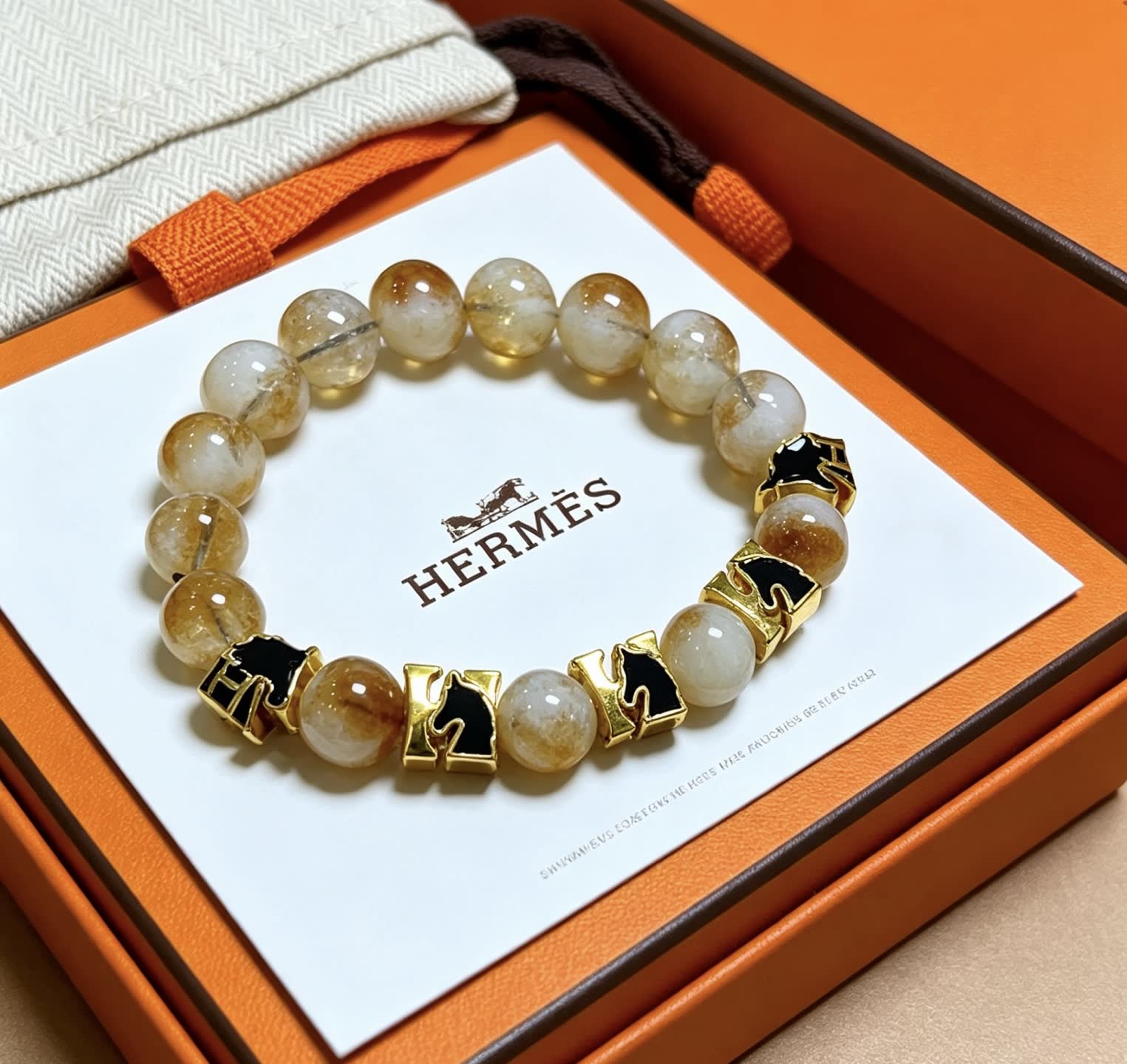 Hermes Hermès Bracelet with Gold and Black Accents
