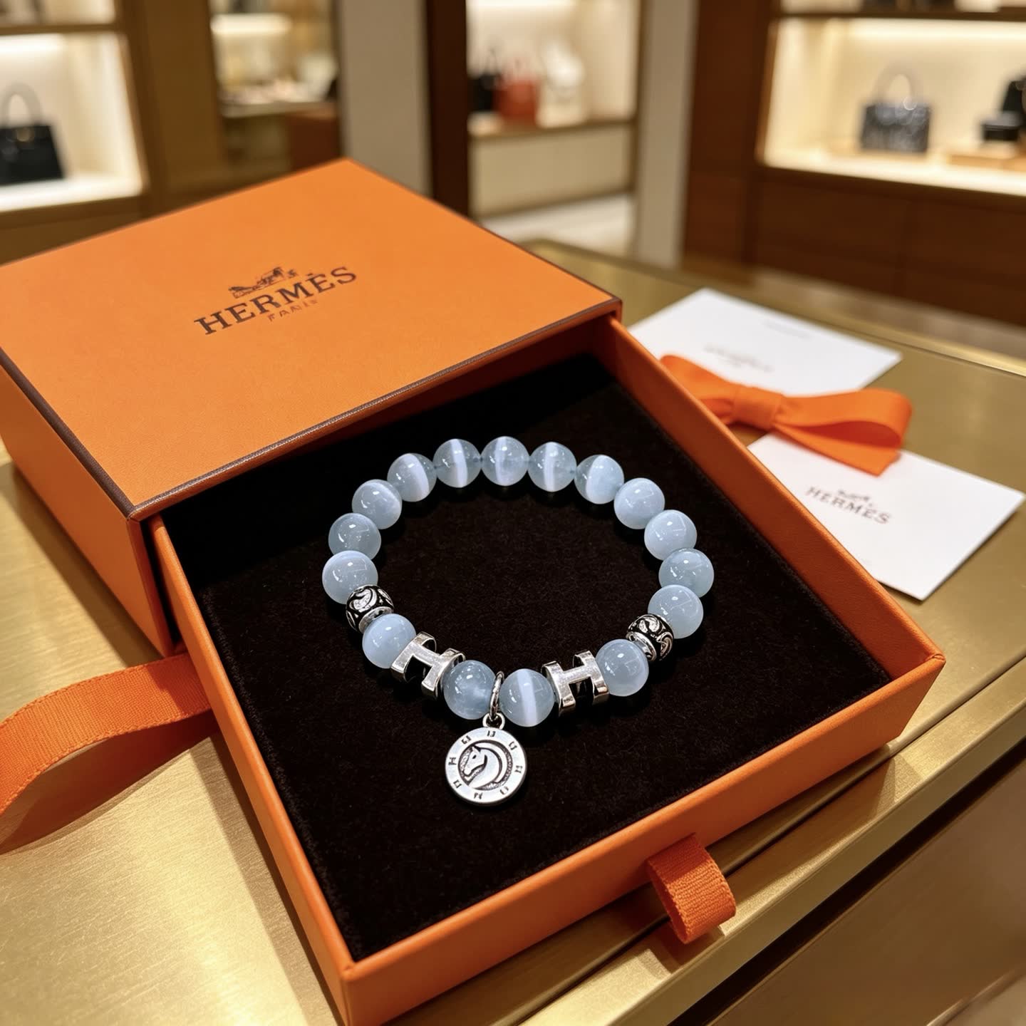 Hermes Hermès Blue Opal Beaded Bracelet with H Logo and Medallion Hermes Hermès Blue Opal Beaded Bracelet with H Logo and Medallion