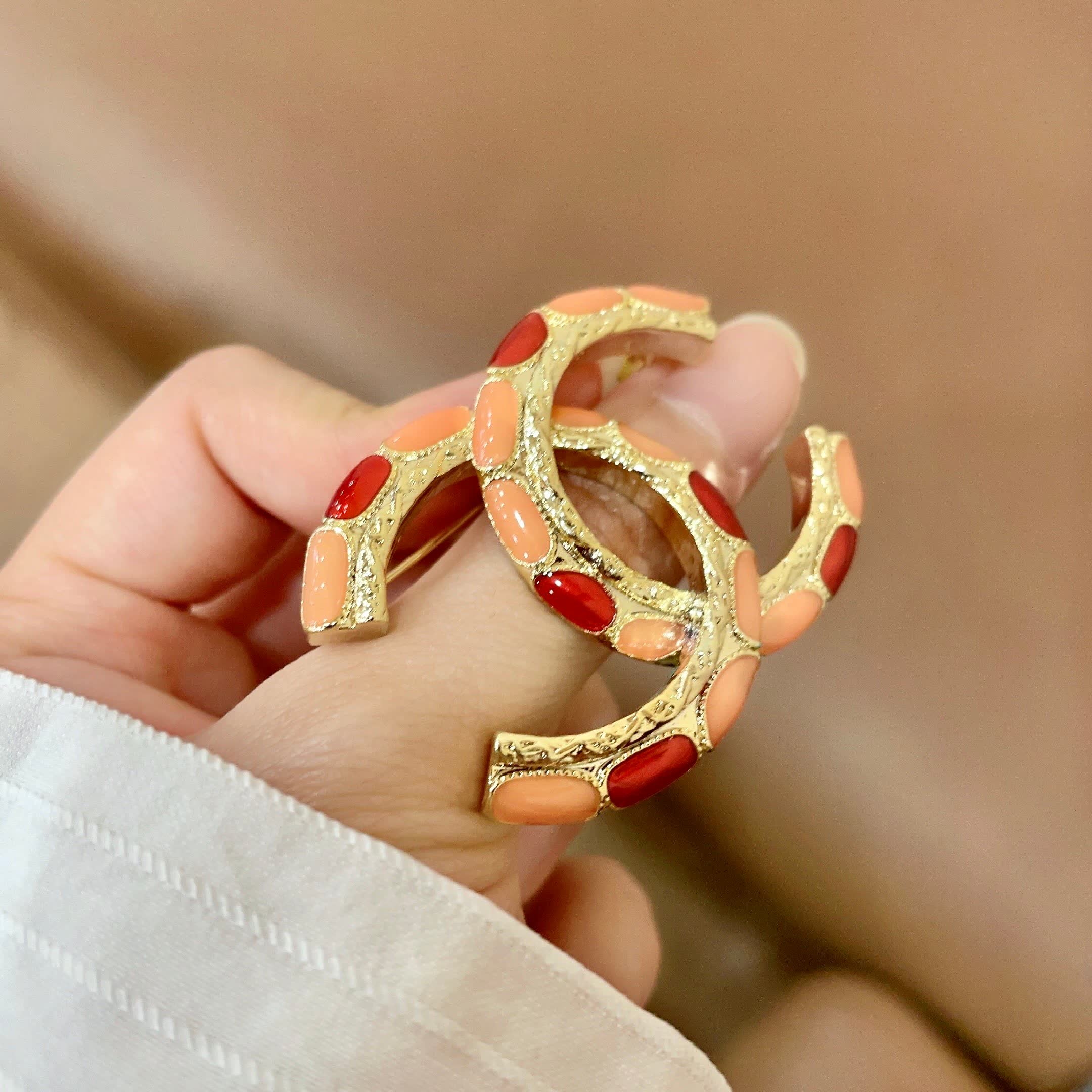 Chanel CC Brooch with Coral Inlay