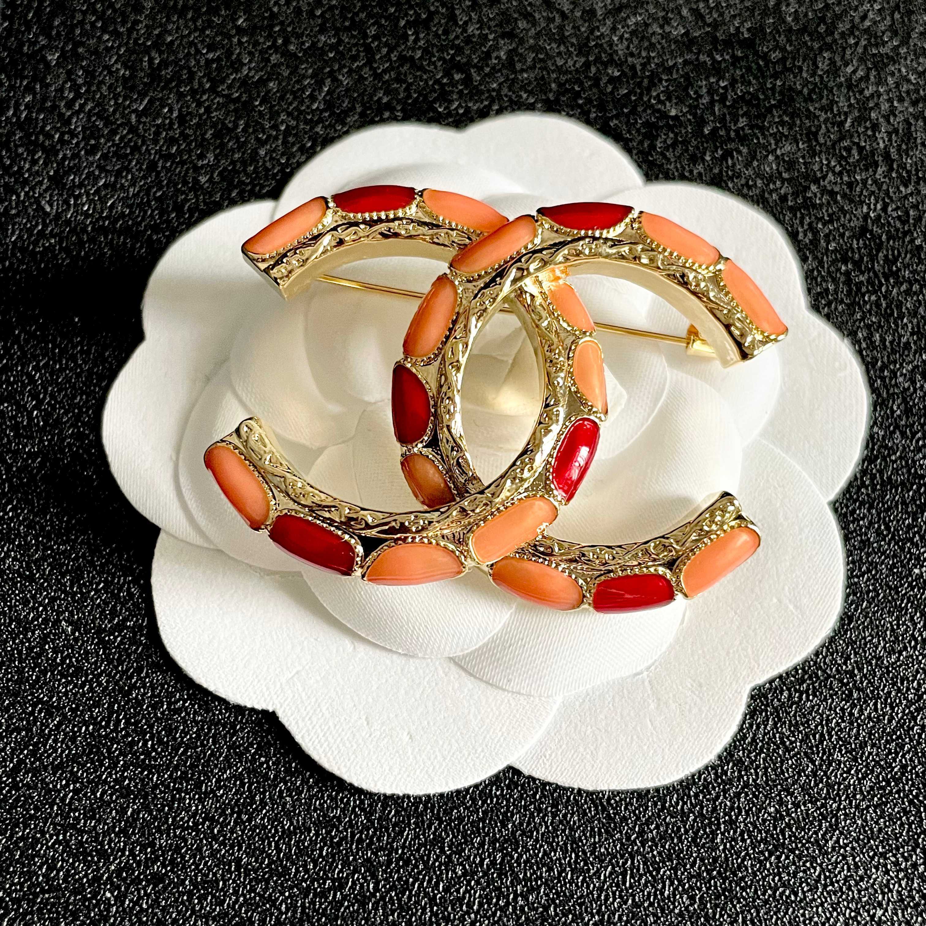 Chanel CC Brooch with Coral Inlay