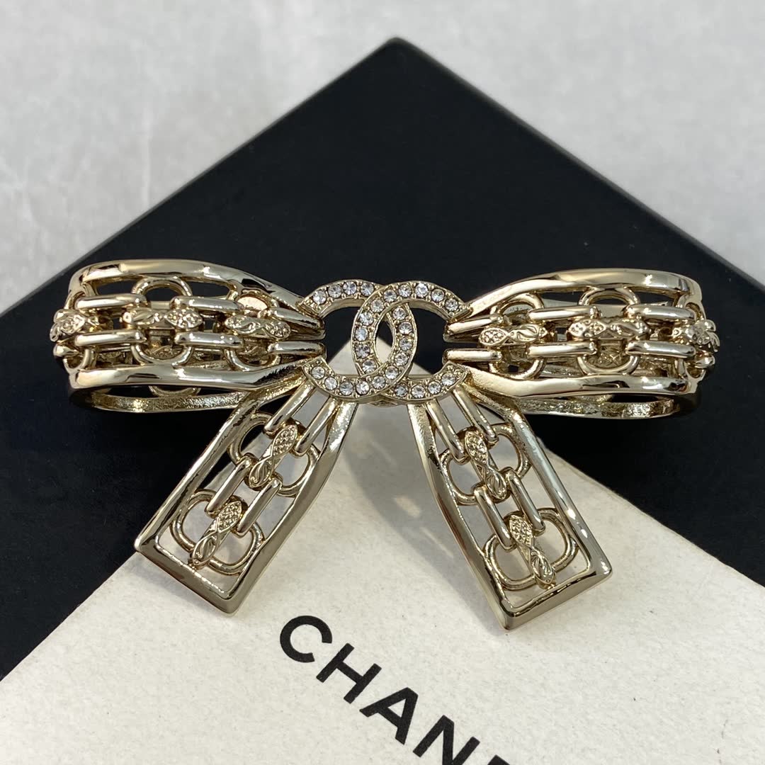 Chanel Gold Tone Rhinestone Bow Brooch Chanel Gold Tone Rhinestone Bow Brooch