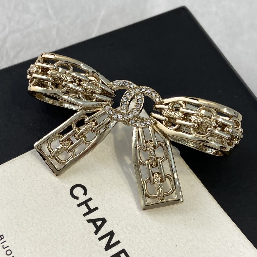 Chanel Gold Tone Rhinestone Bow Brooch