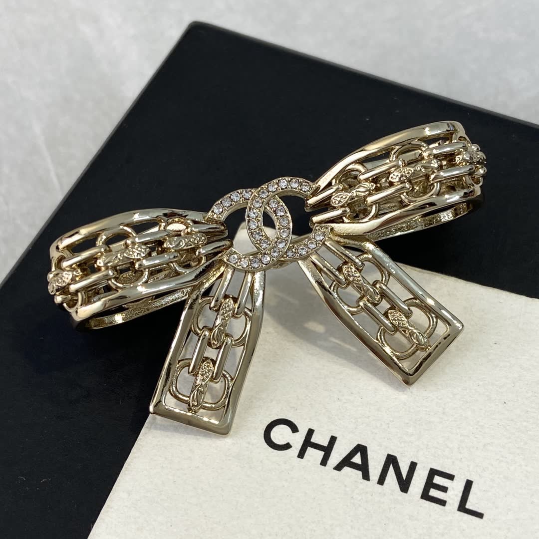 Chanel Gold Tone Rhinestone Bow Brooch