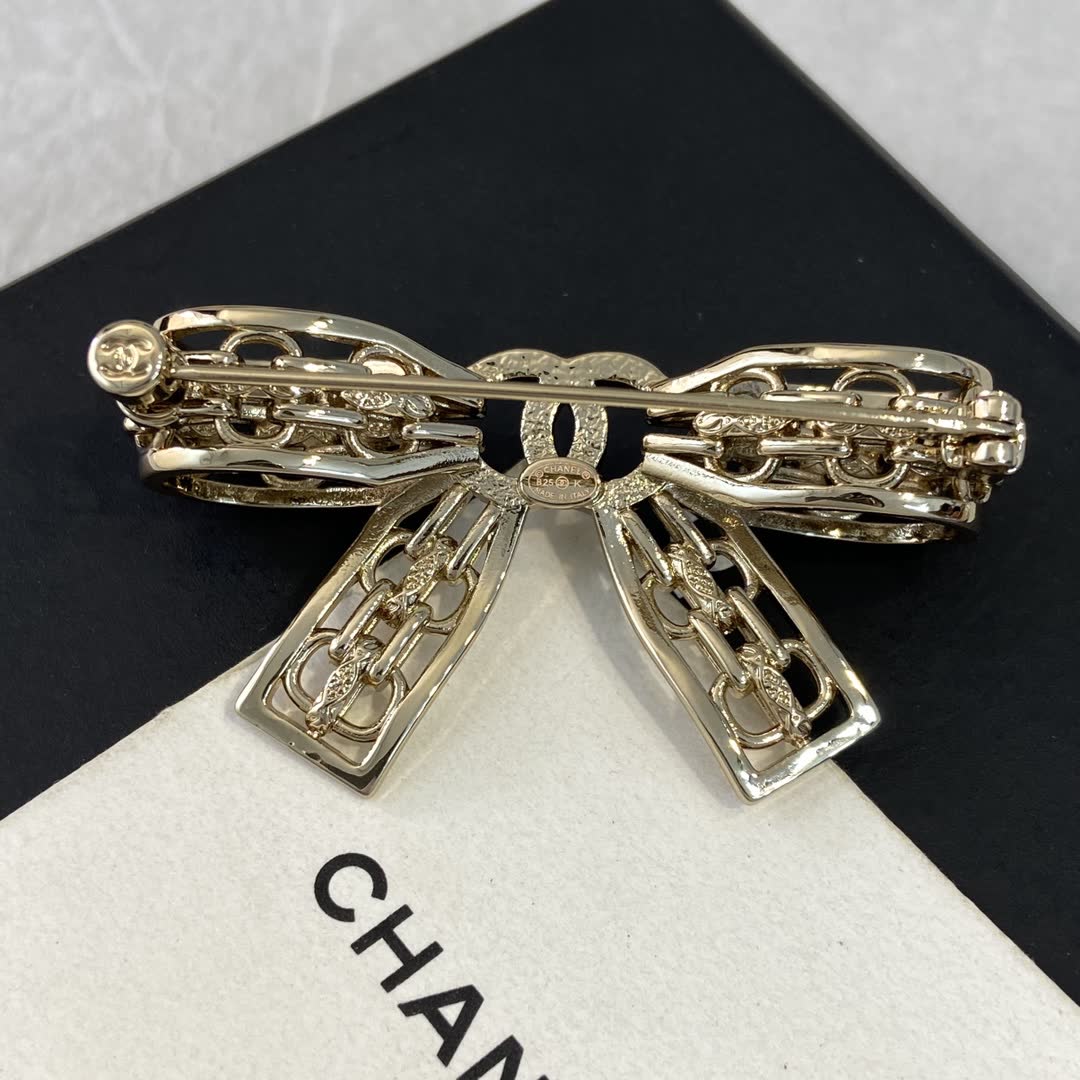 Chanel Gold Tone Rhinestone Bow Brooch