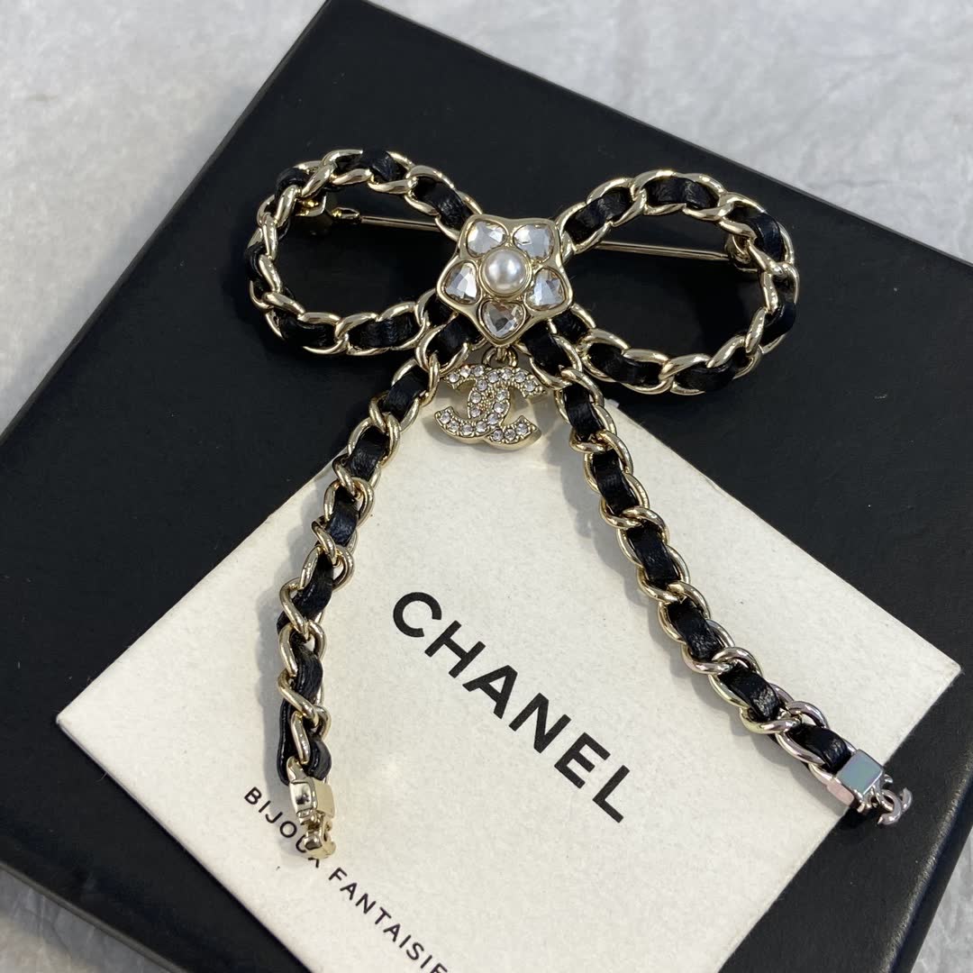 Chanel Black Leather and Gold Chain Bow Brooch