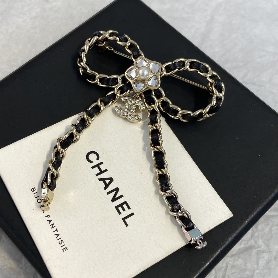 Chanel Black Leather and Gold Chain Bow Brooch