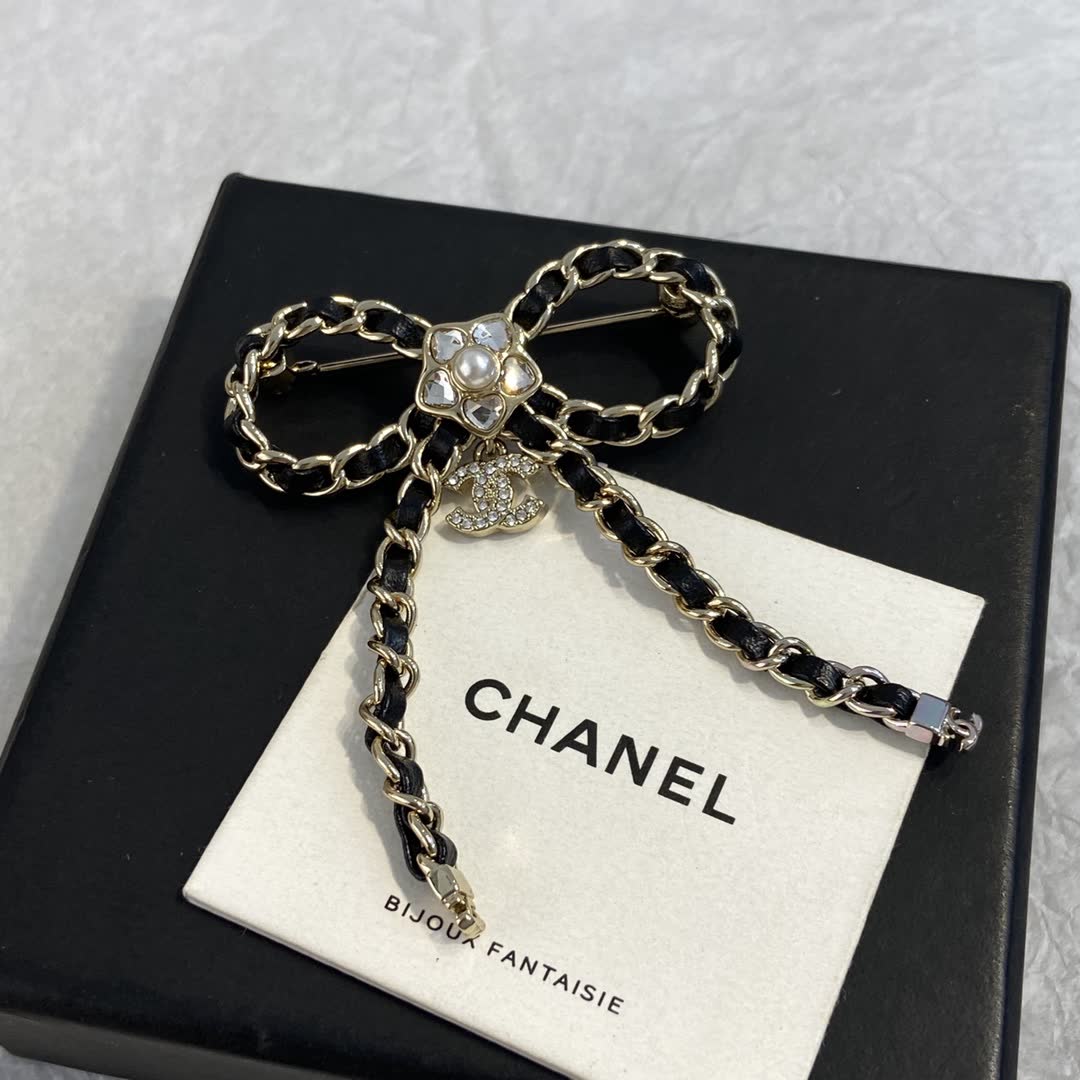 Chanel Black Leather and Gold Chain Bow Brooch