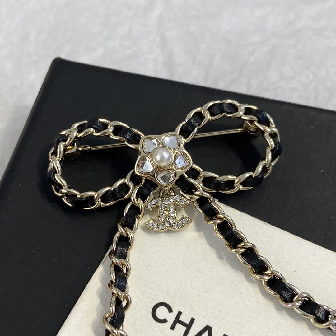 Chanel Black Leather and Gold Chain Bow Brooch