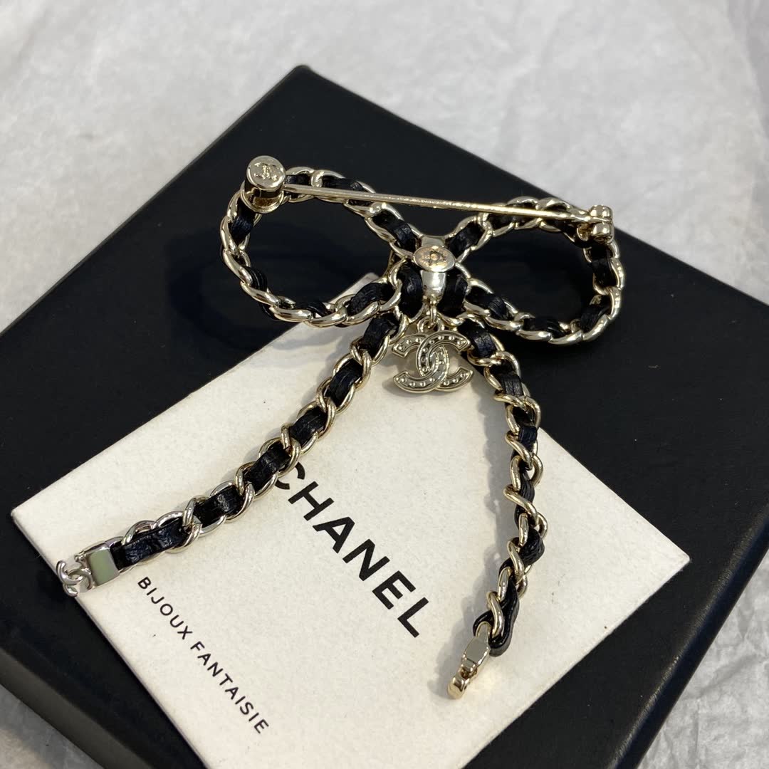 Chanel Black Leather and Gold Chain Bow Brooch