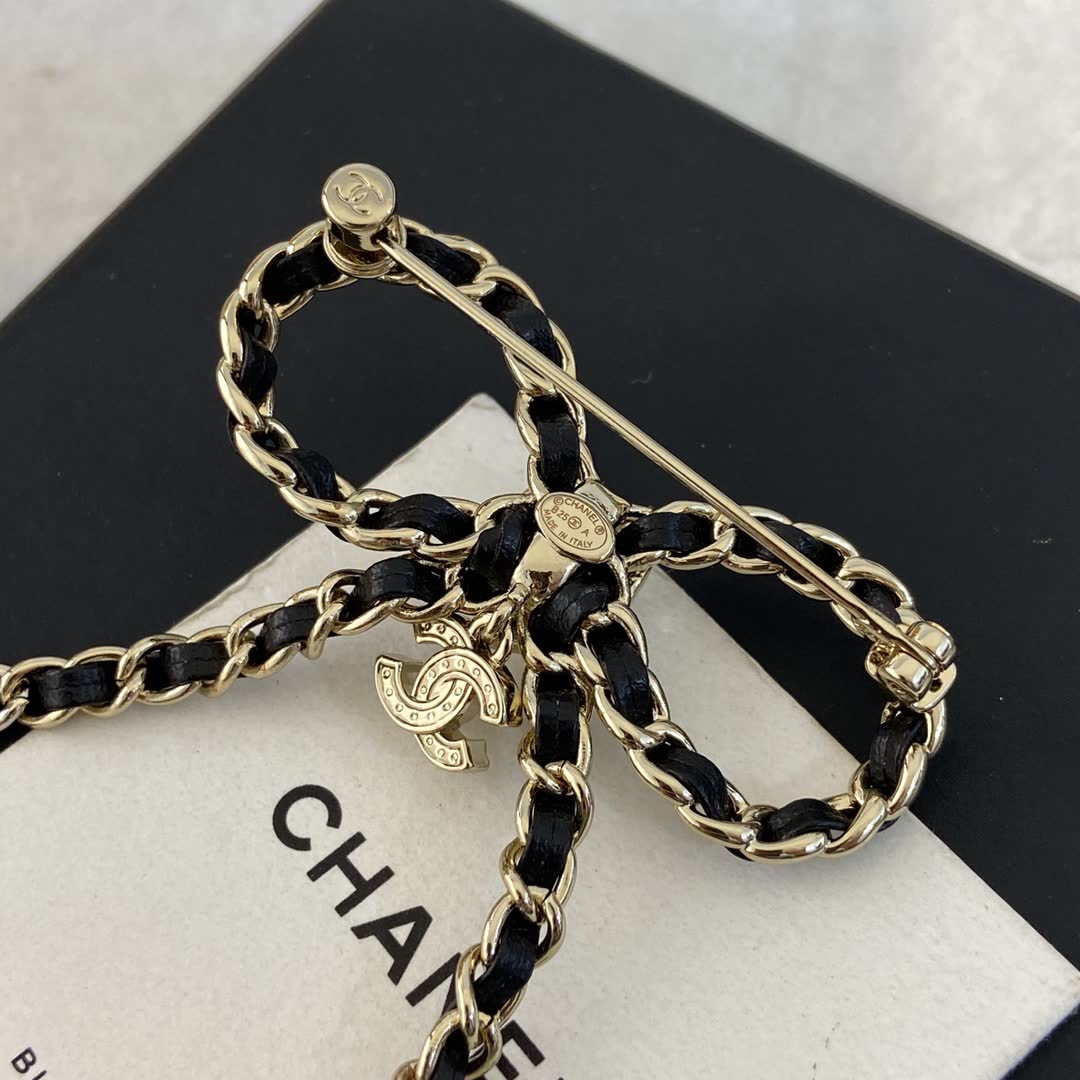 Chanel Black Leather and Gold Chain Bow Brooch