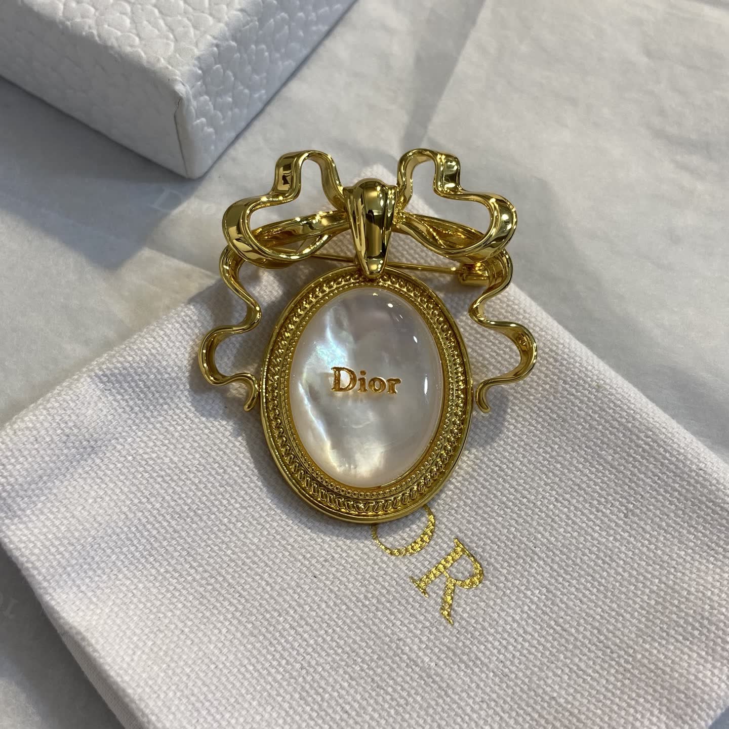 Dior Gold Tone Brooch with Pearl and Bow Design
