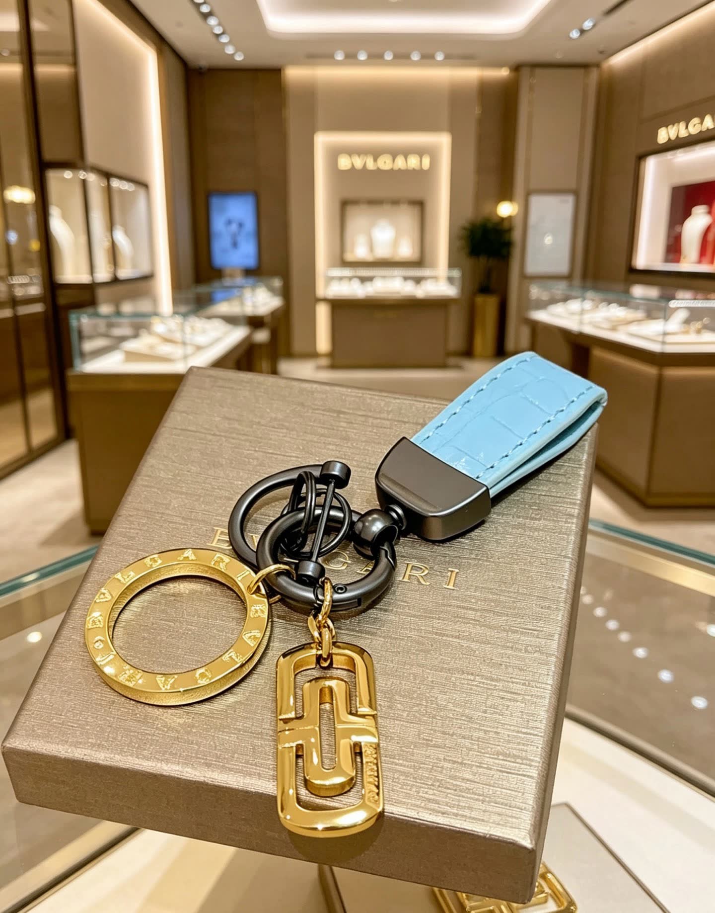 Bvlgari Blue Leather Keychain with Gold Charms