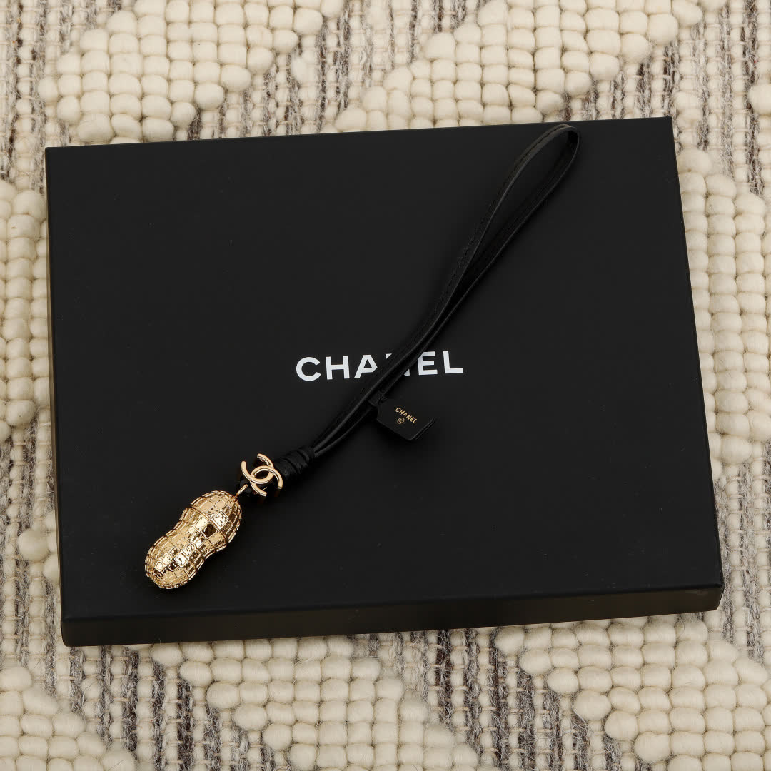 Chanel Gold Peanut Charm with Leather Strap Chanel Gold Peanut Charm with Leather Strap