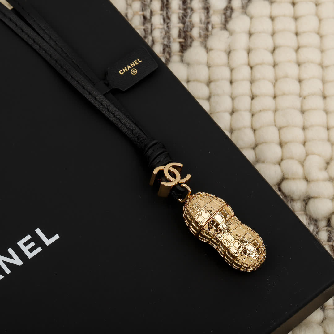 Chanel Gold Peanut Charm with Leather Strap