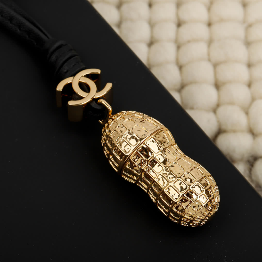 Chanel Gold Peanut Charm with Leather Strap