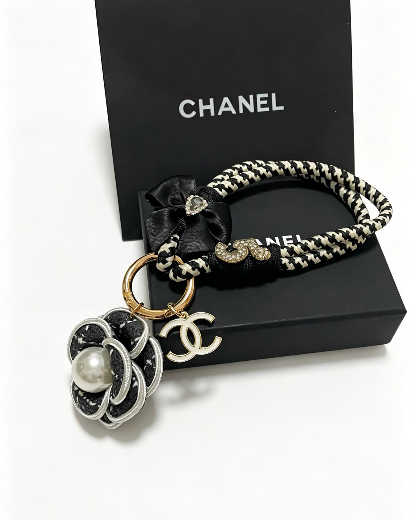 Chanel Black and White Braided Keychain with Pearl Flower Charm