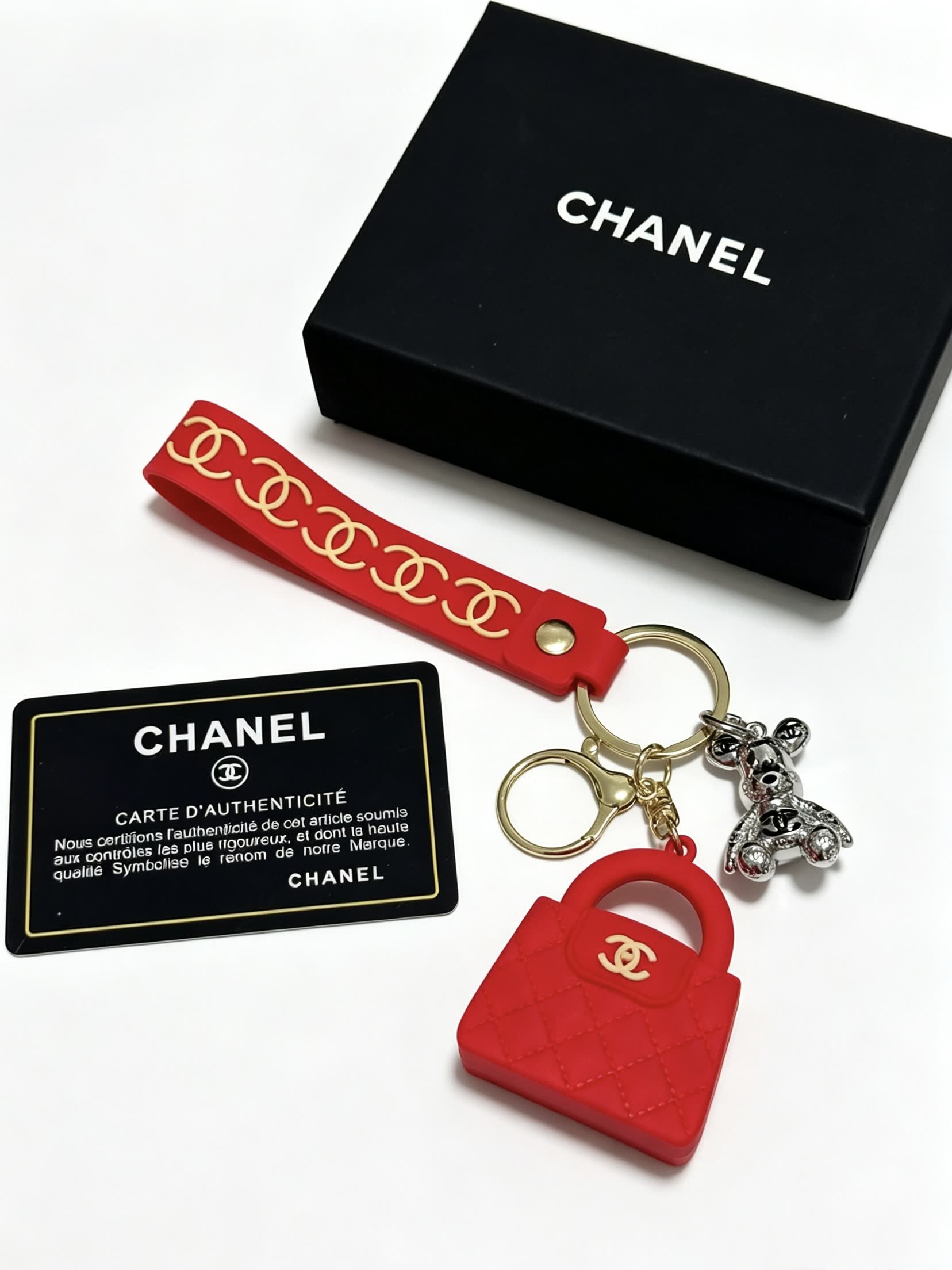 Chanel Red Rubber Keychain with Gold Chain Strap and Silver Bear Charm
