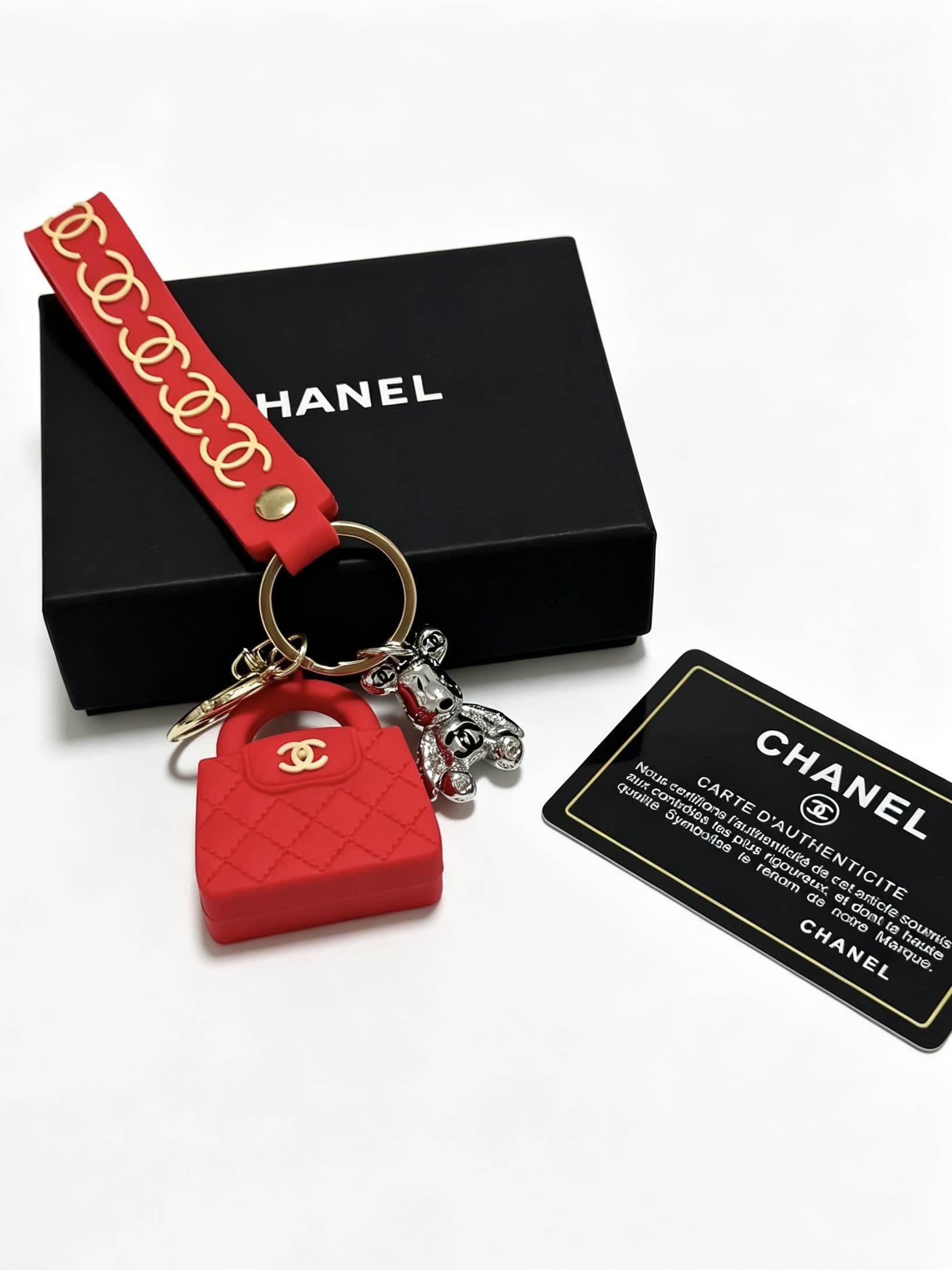 Chanel Red Rubber Keychain with Gold Chain Strap and Silver Bear Charm