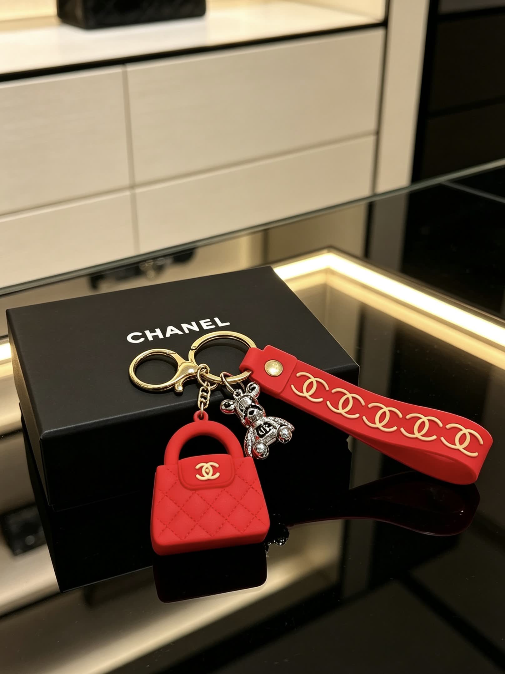 Chanel Red Rubber Keychain with Gold Chain Strap and Silver Bear Charm