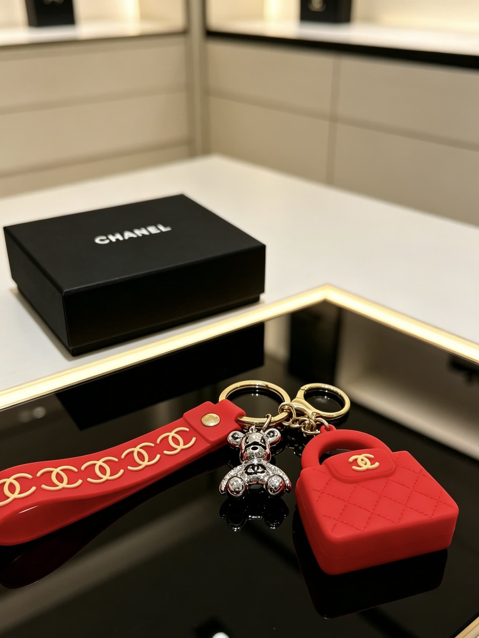 Chanel Red Rubber Keychain with Gold Chain Strap and Silver Bear Charm