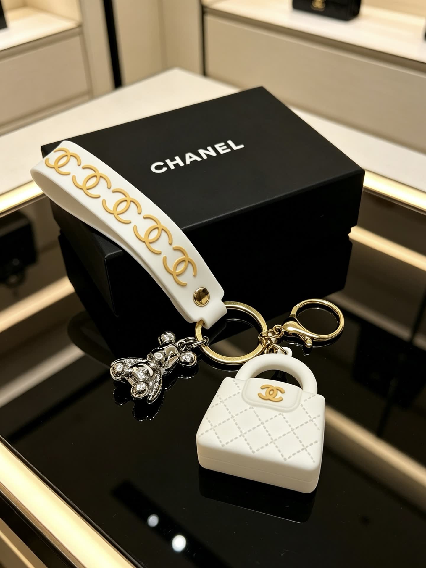 Chanel White Leather Keychain with Gold Chain Strap and Silver Bear Charm