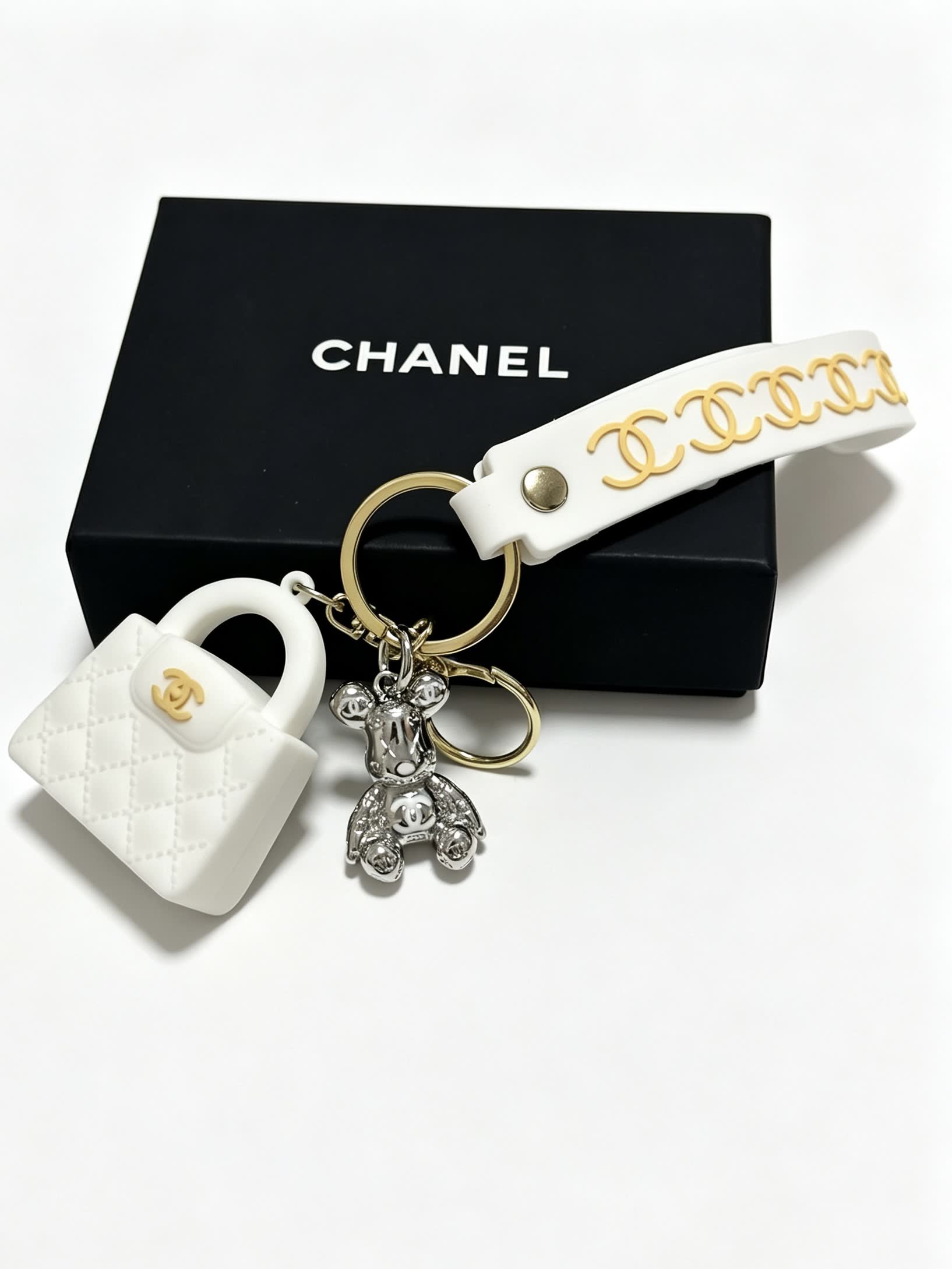 Chanel White Leather Keychain with Gold Chain Strap and Silver Bear Charm