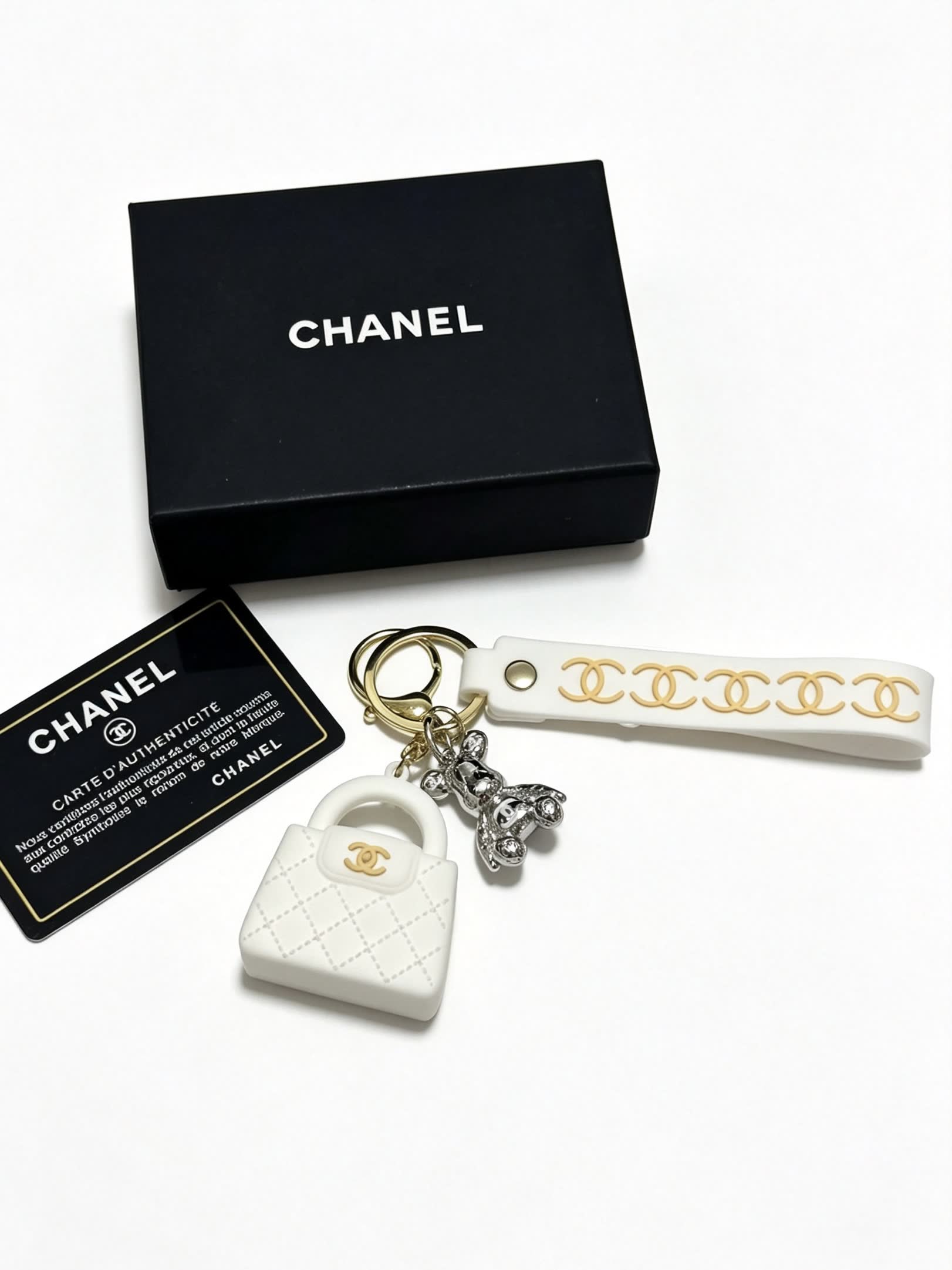 Chanel White Leather Keychain with Gold Chain Strap and Silver Bear Charm