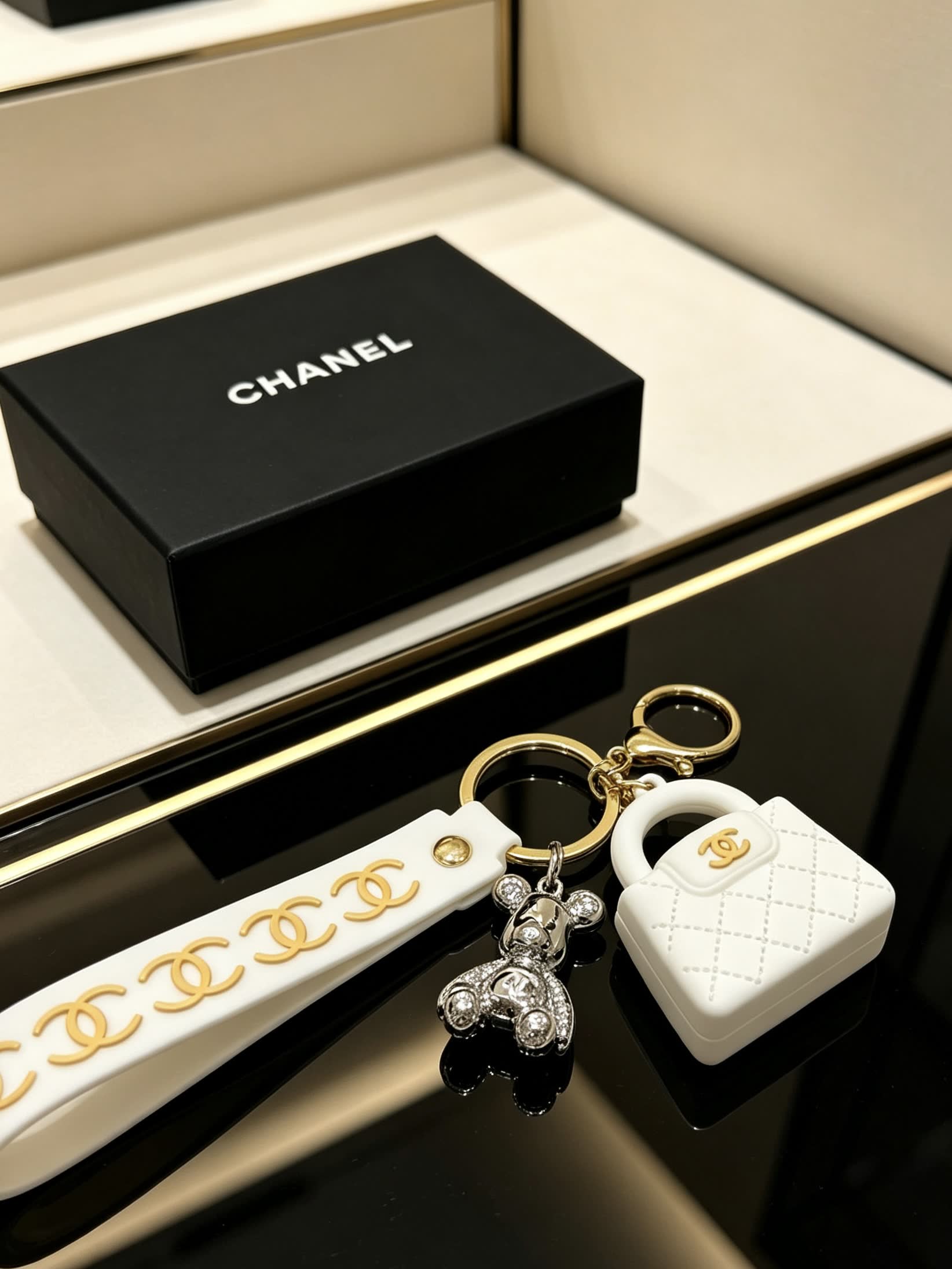 Chanel White Leather Keychain with Gold Chain Strap and Silver Bear Charm