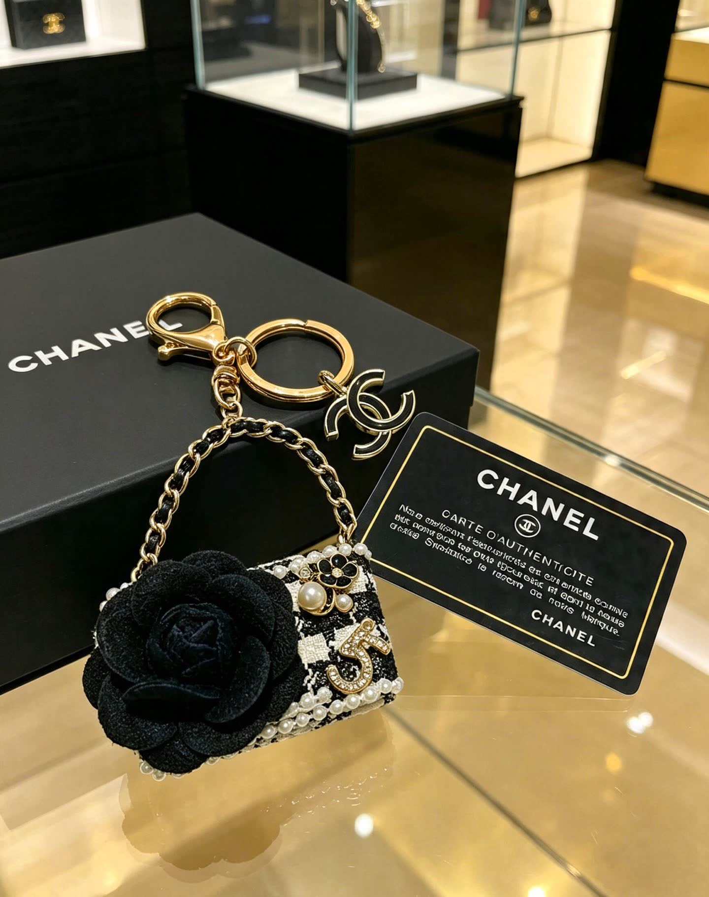 Chanel Black and White Beaded Keychain with Large Flower Chanel Black and White Beaded Keychain with Large Flower