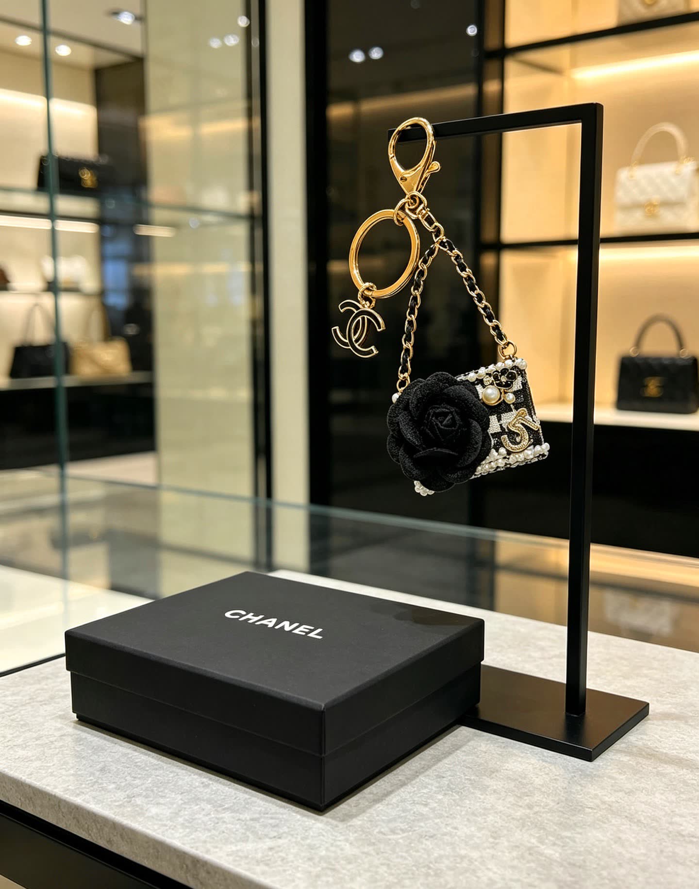 Chanel Black and White Beaded Keychain with Large Flower