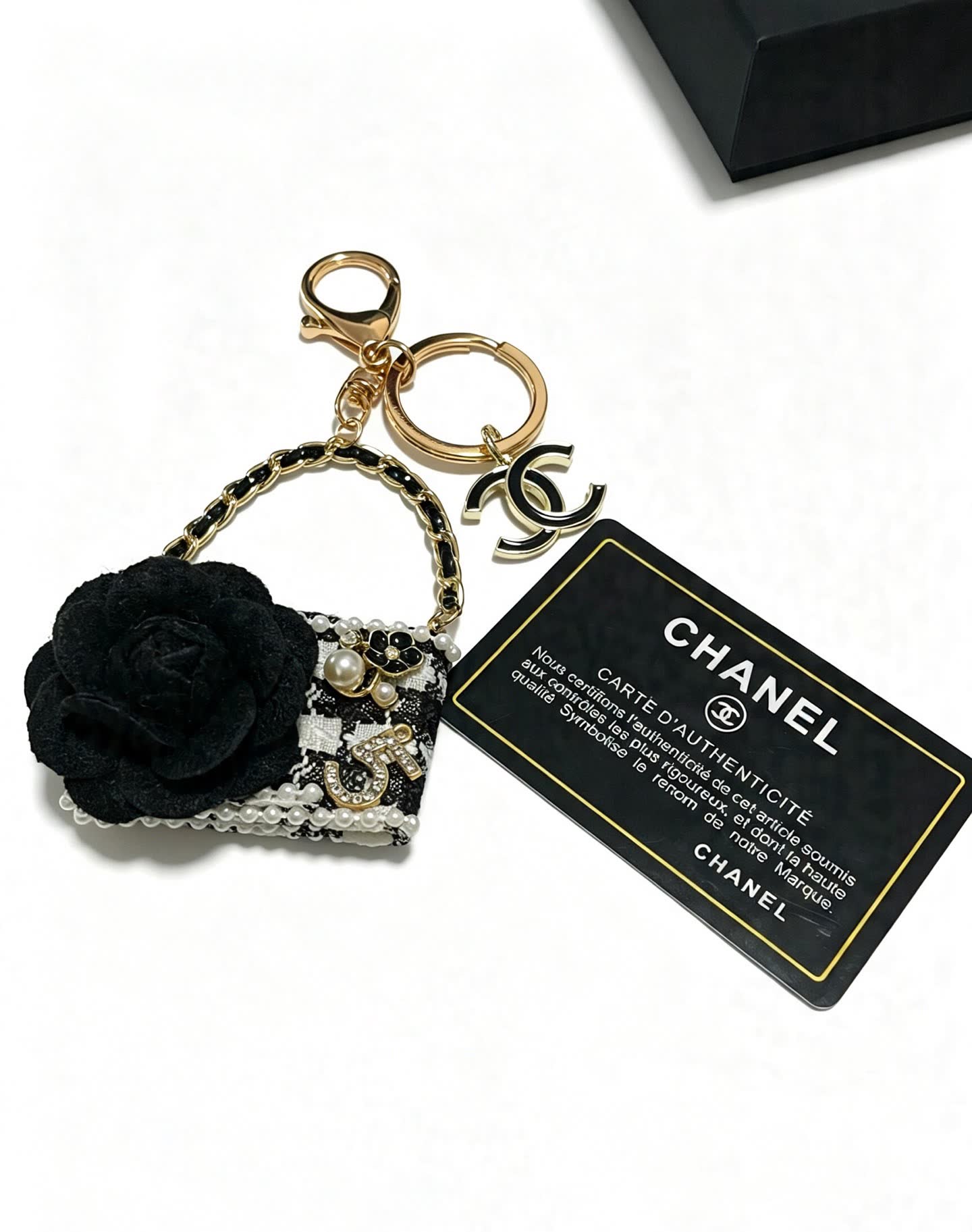 Chanel Black and White Beaded Keychain with Large Flower