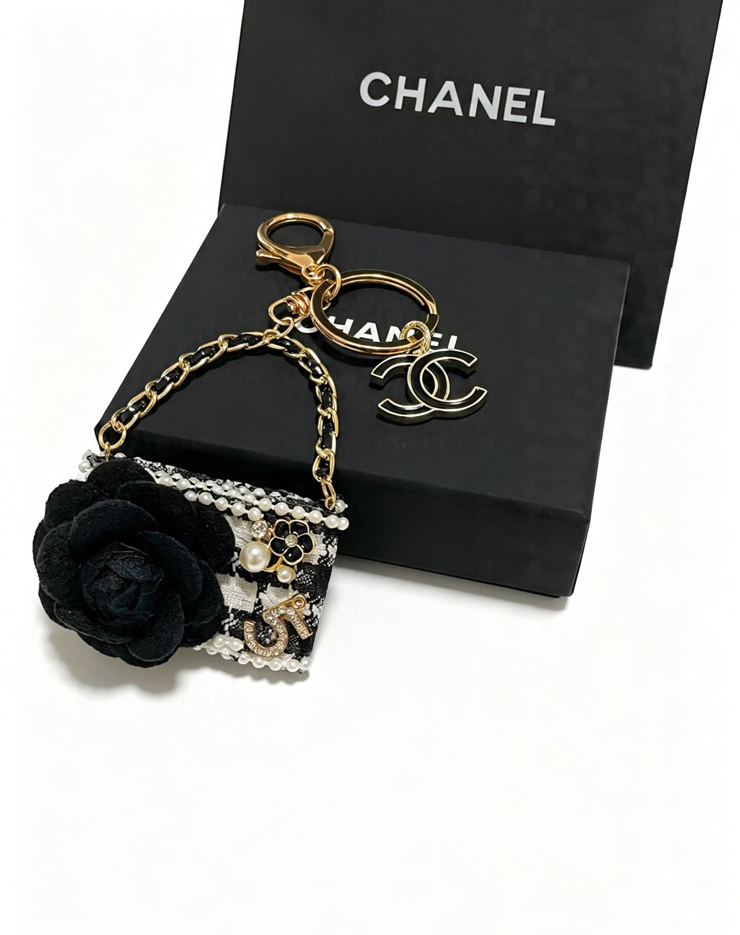 Chanel Black and White Beaded Keychain with Large Flower