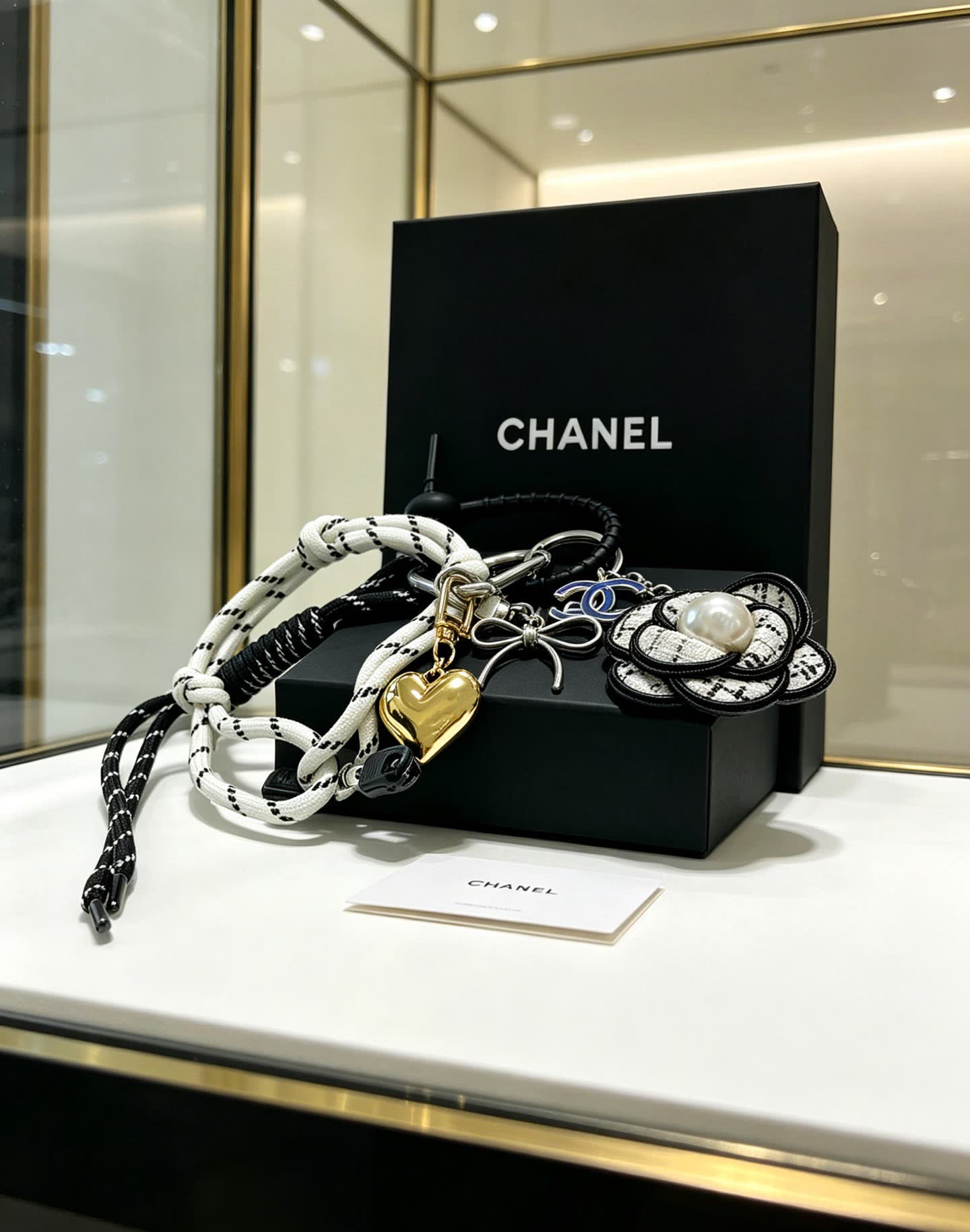 Chanel Keychain with Rope and Flower Design
