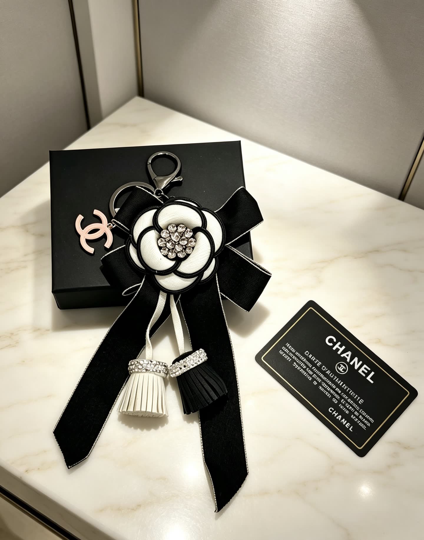 Chanel Black and White Camellia Keychain