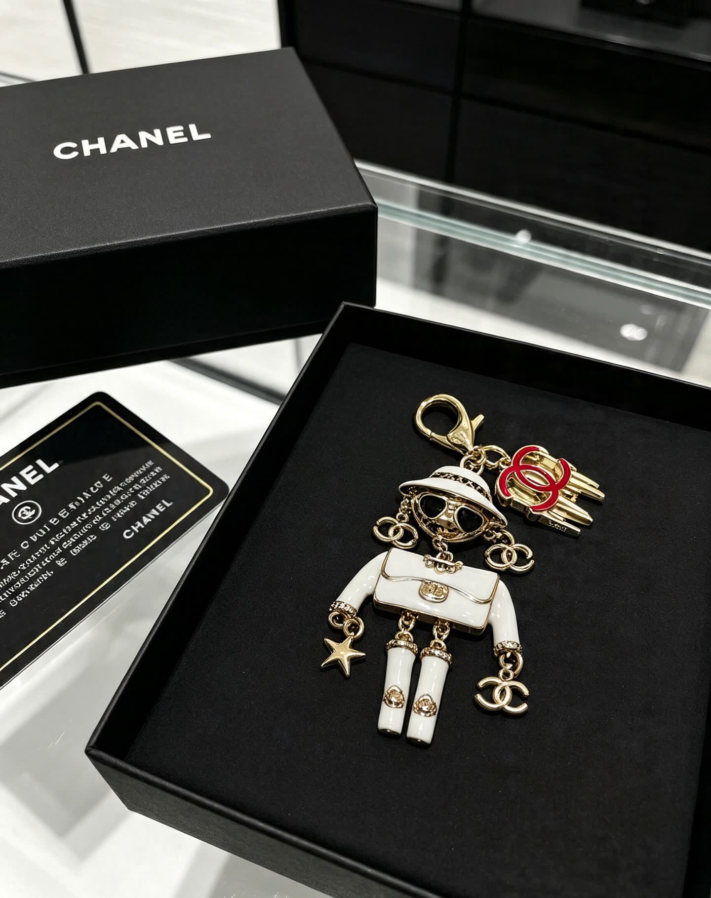 Chanel Gold and White Enamel Charm Keychain Chanel Gold and White Enamel Charm Keychain