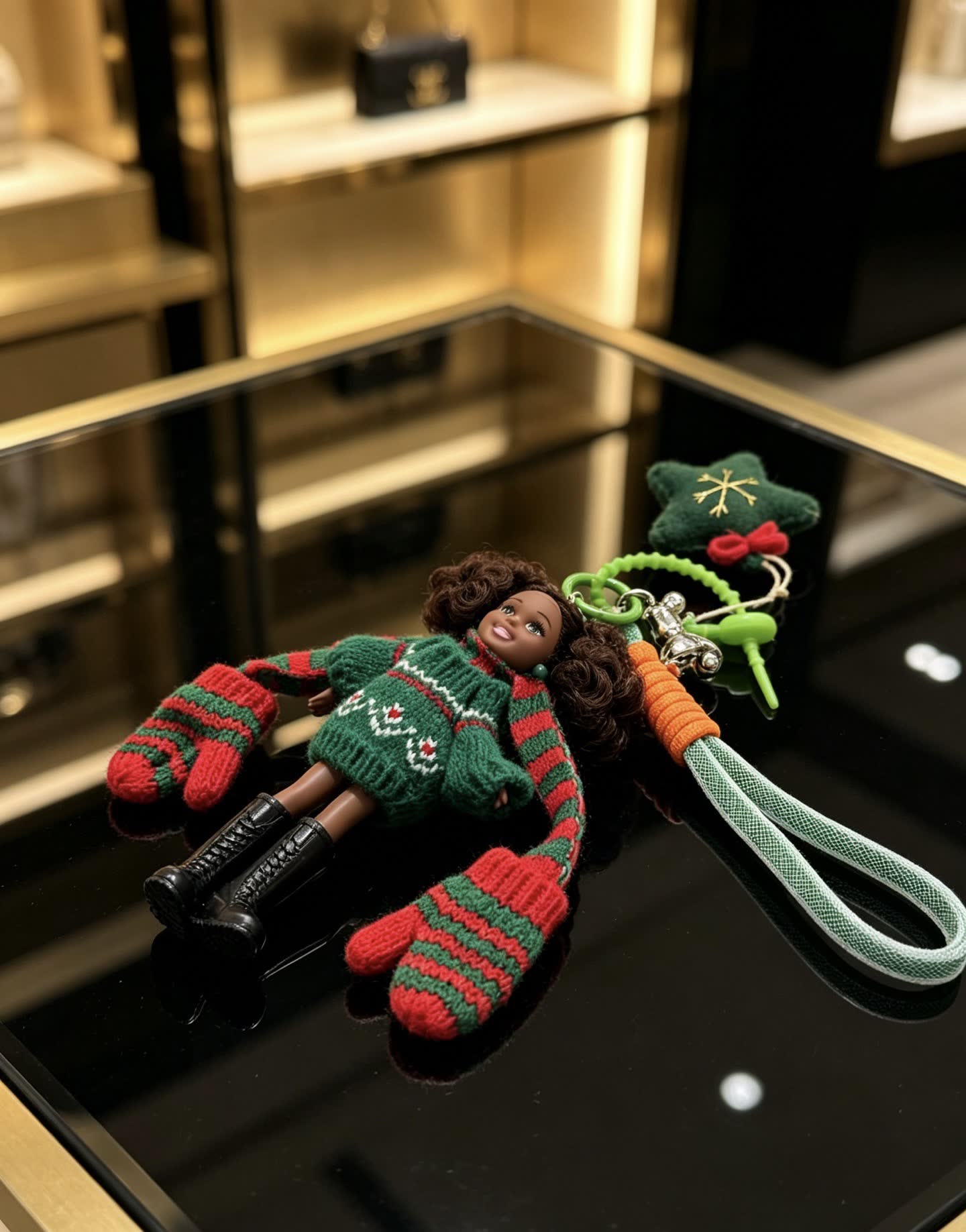 Chanel Christmas-themed keychain with doll and festive accessories