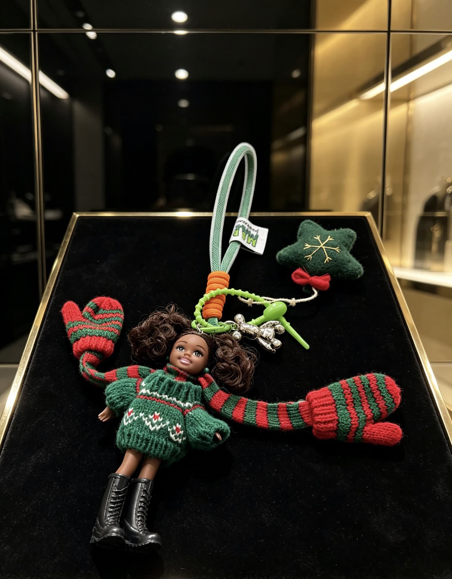 Chanel Christmas-themed keychain with doll and festive accessories
