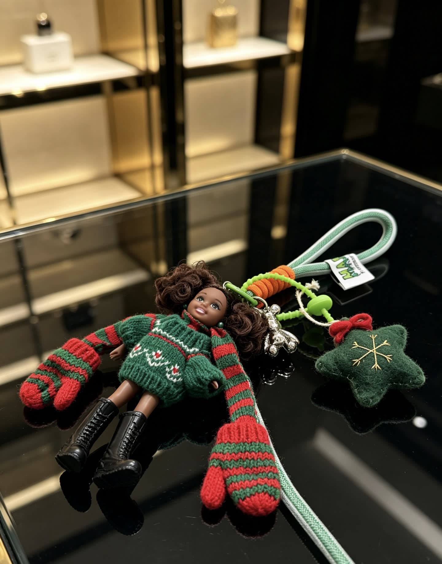 Chanel Christmas-themed keychain with doll and festive accessories