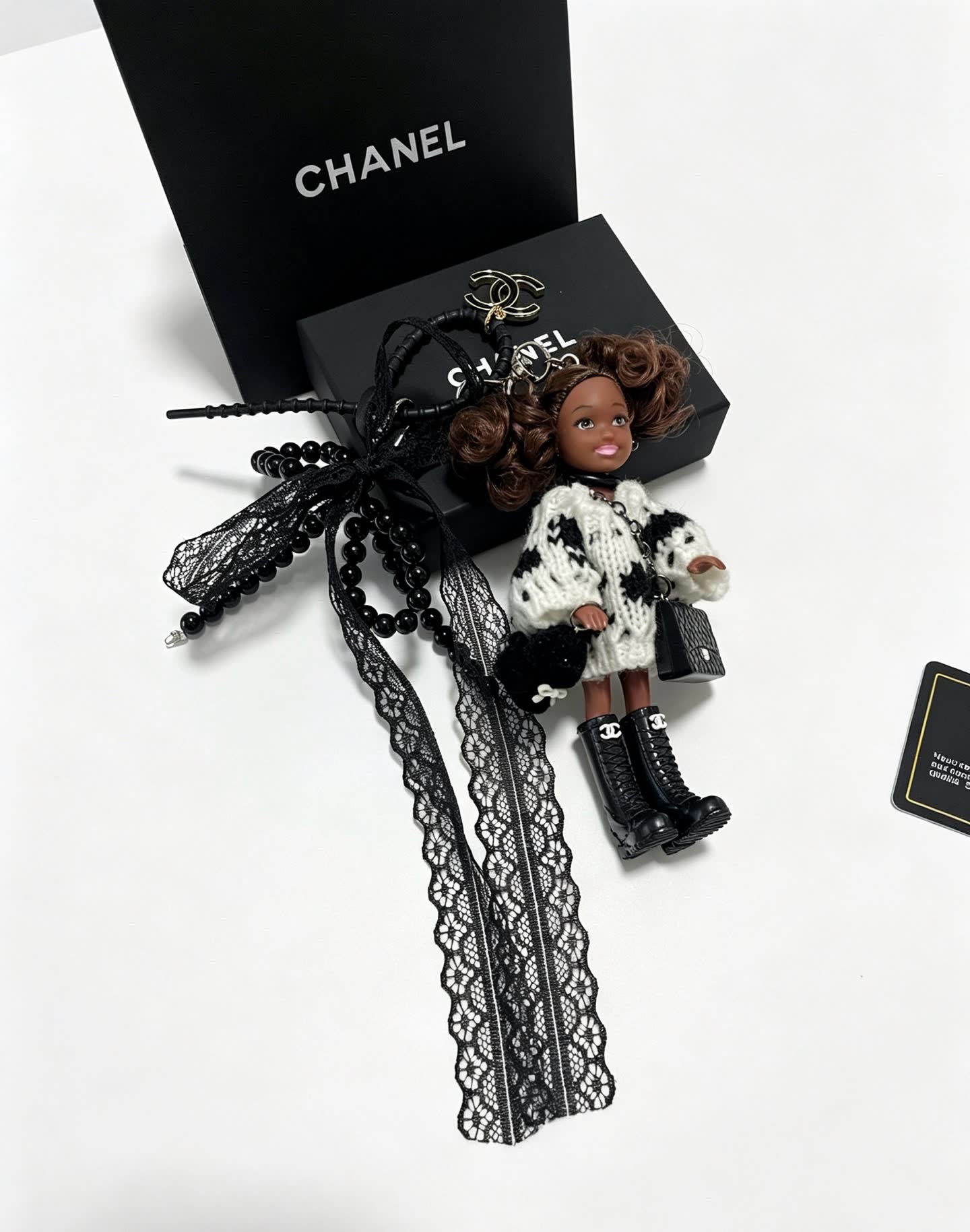 Chanel Keychain with Beaded Chain and Doll Charm