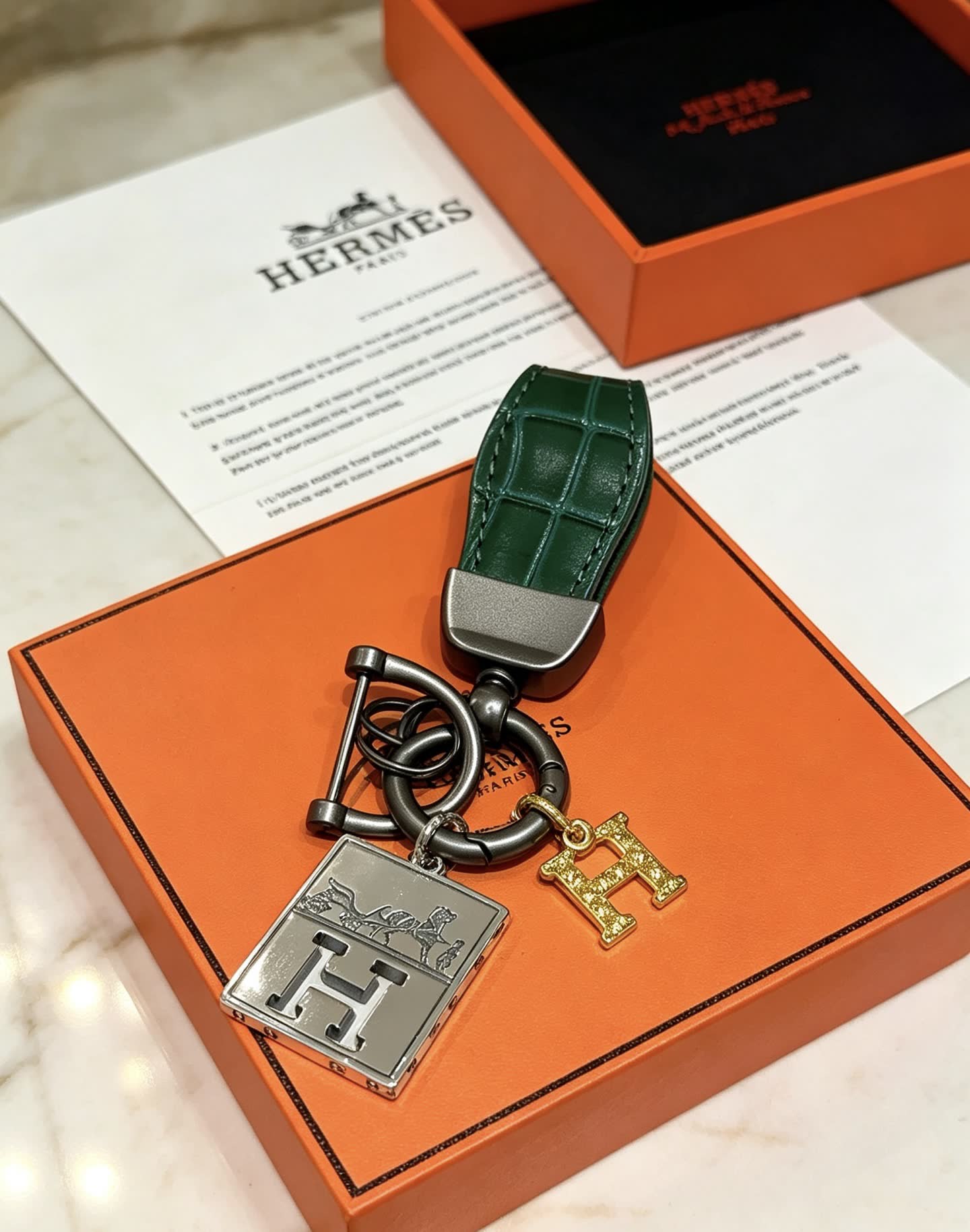 Hermes Hermès Paris Leather Bag Charm with Gold 'H' and Silver Plate
