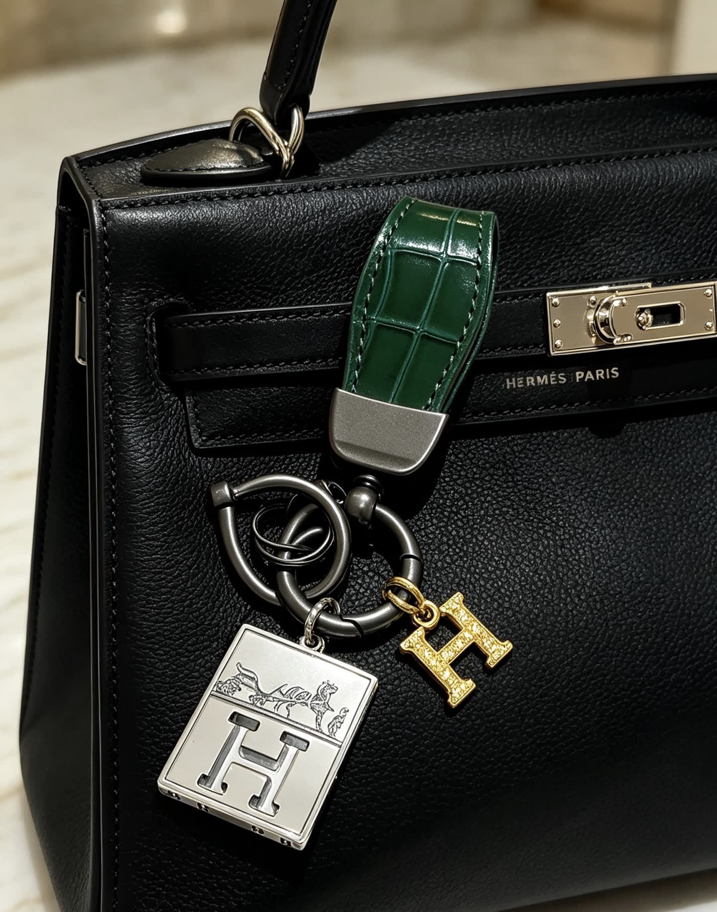 Hermes Hermès Paris Leather Bag Charm with Gold 'H' and Silver Plate