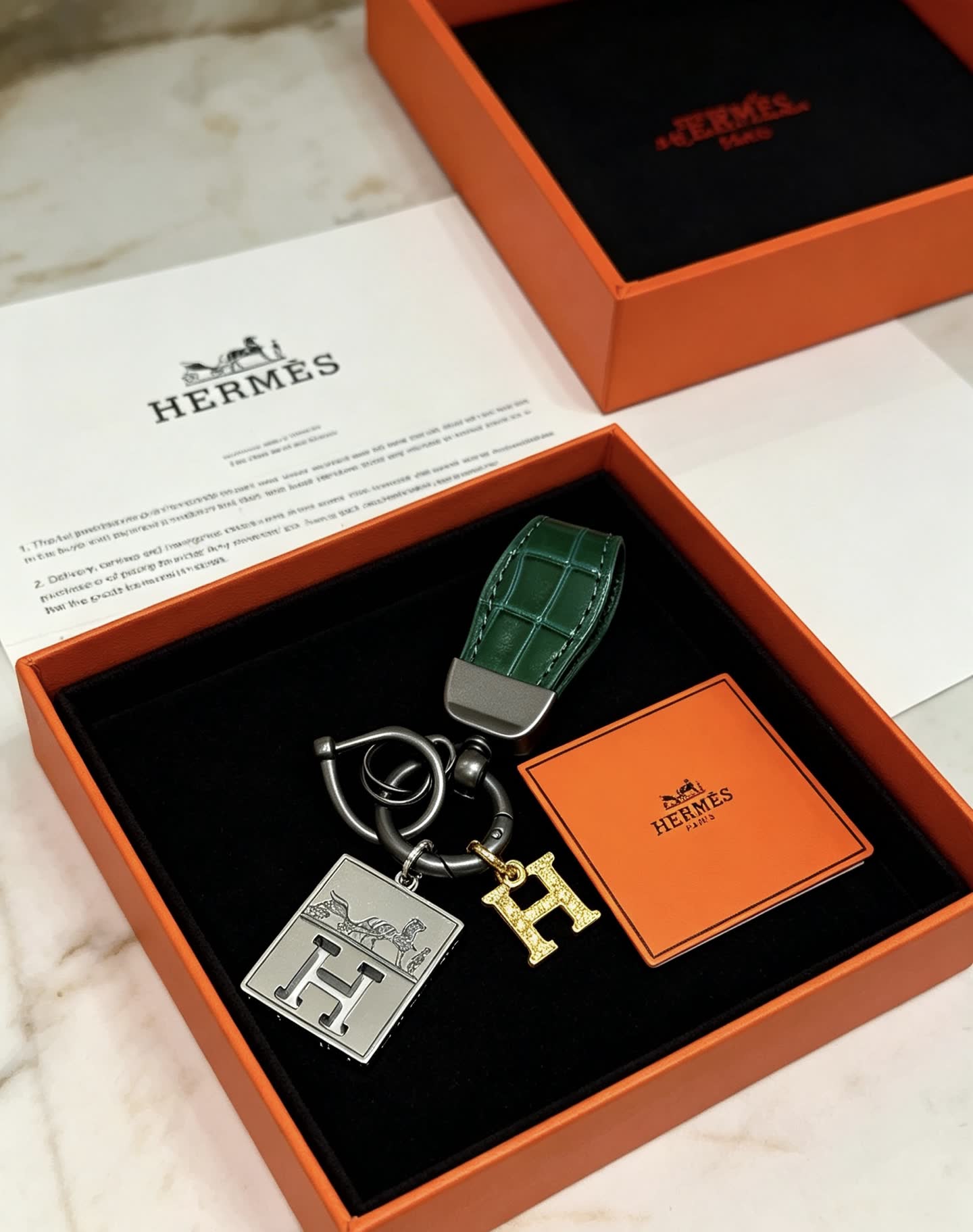 Hermes Hermès Paris Leather Bag Charm with Gold 'H' and Silver Plate
