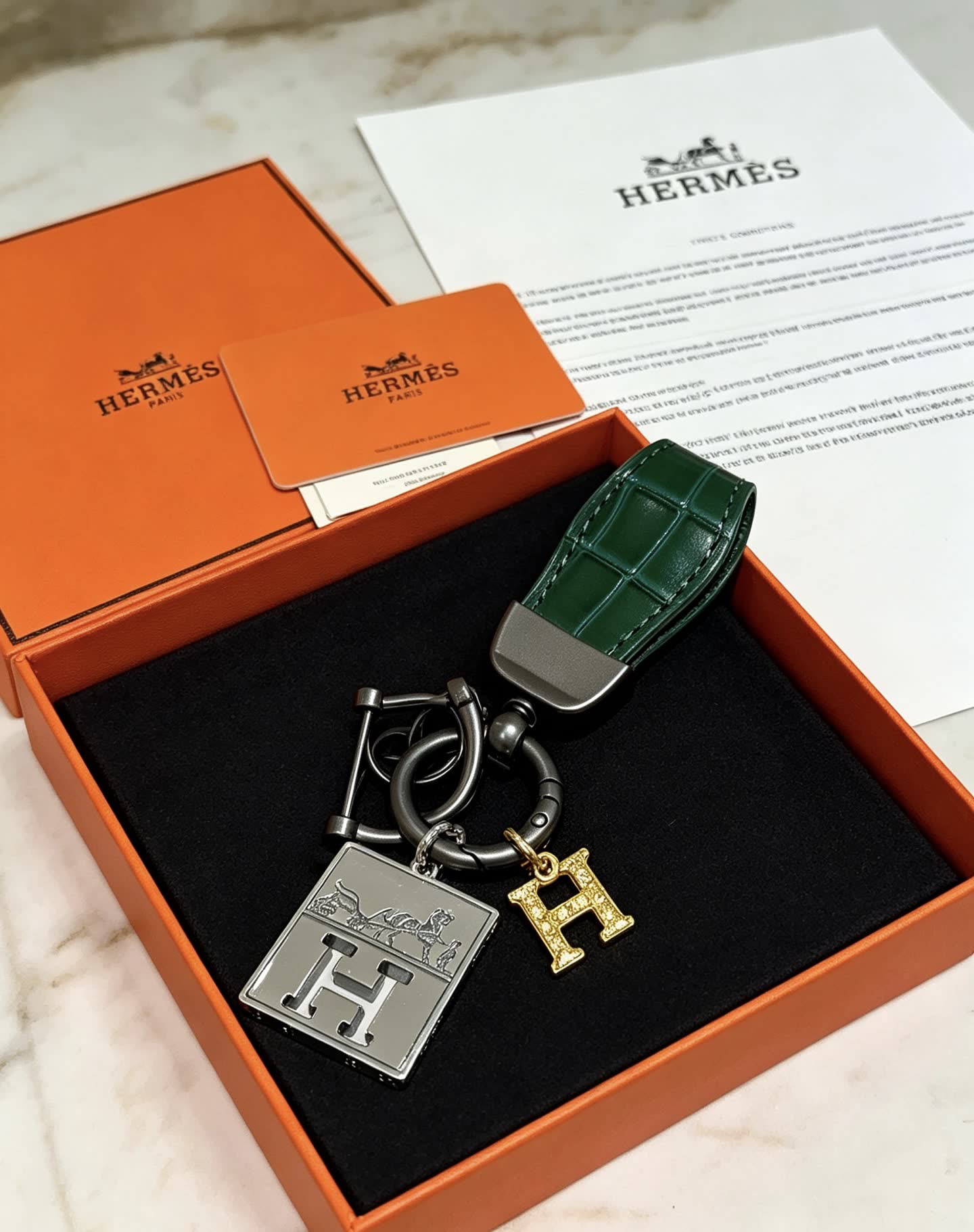 Hermes Hermès Paris Leather Bag Charm with Gold 'H' and Silver Plate