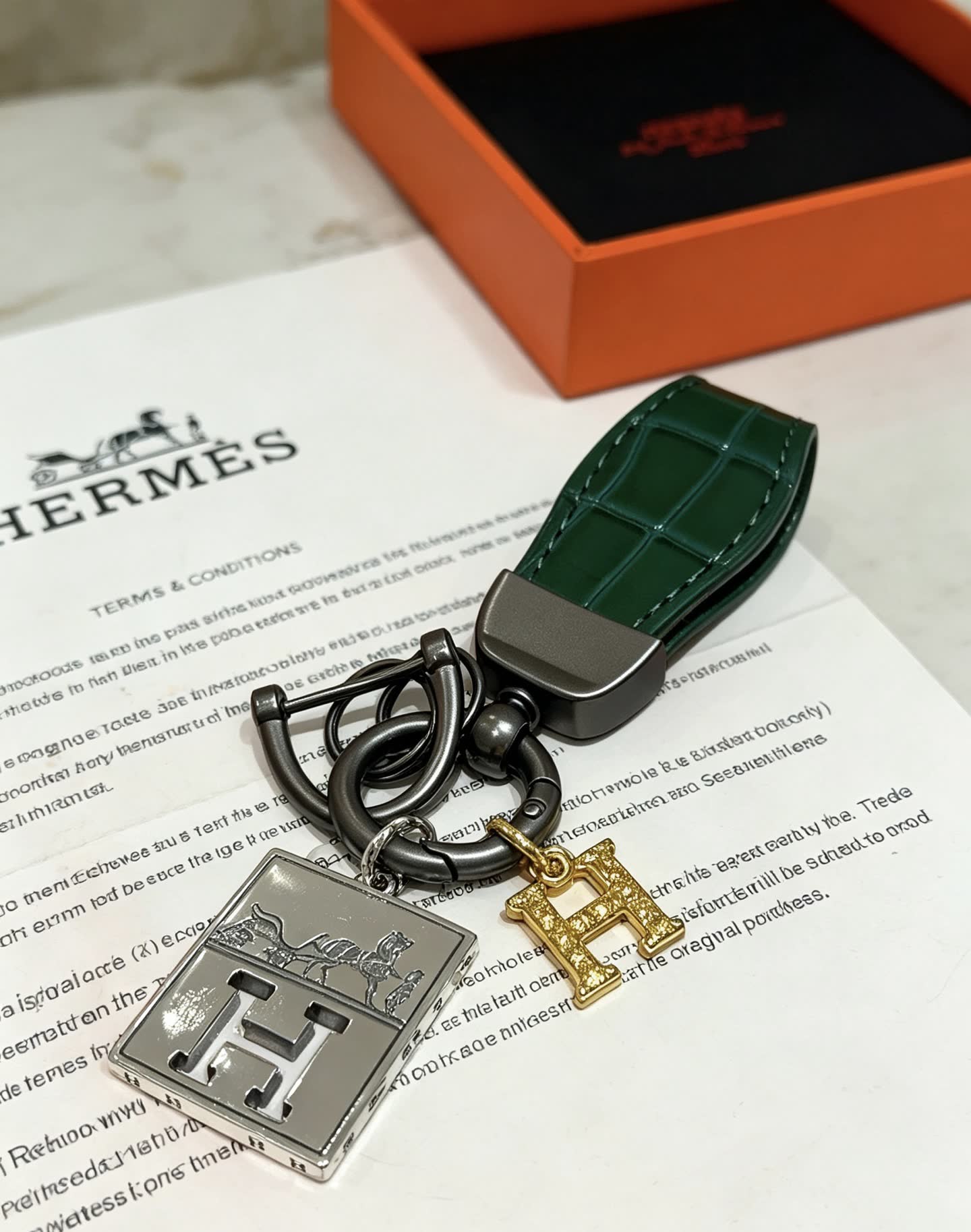 Hermes Hermès Paris Leather Bag Charm with Gold 'H' and Silver Plate